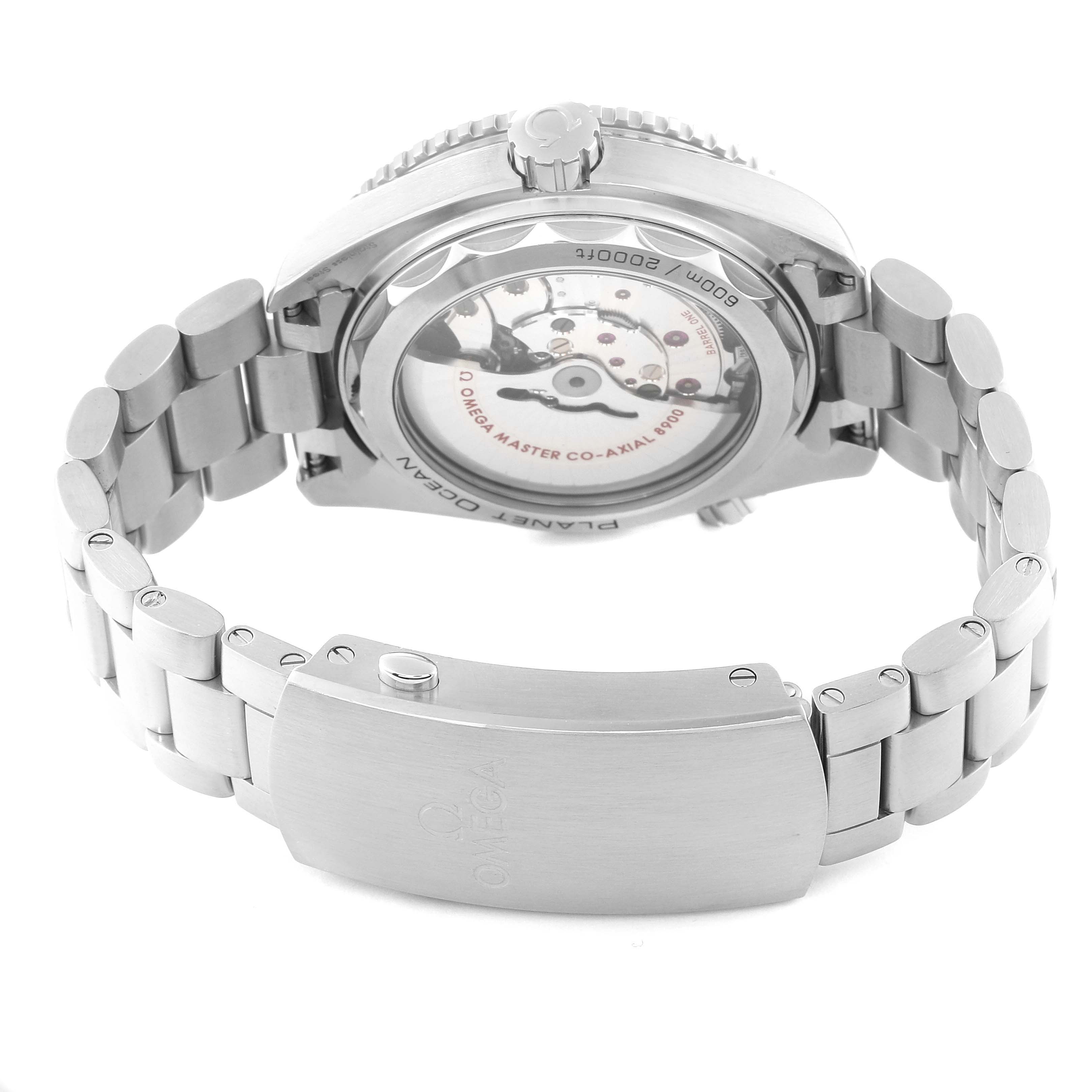 The image shows the back view of the Omega Planet Ocean 215.30.44.21.03.001 Men's Stainless Steel Blue Dial 215.30.44.21.03.001 Men's Stainless Steel Blue Dial watch, focusing on the case back and stainless steel bracelet.