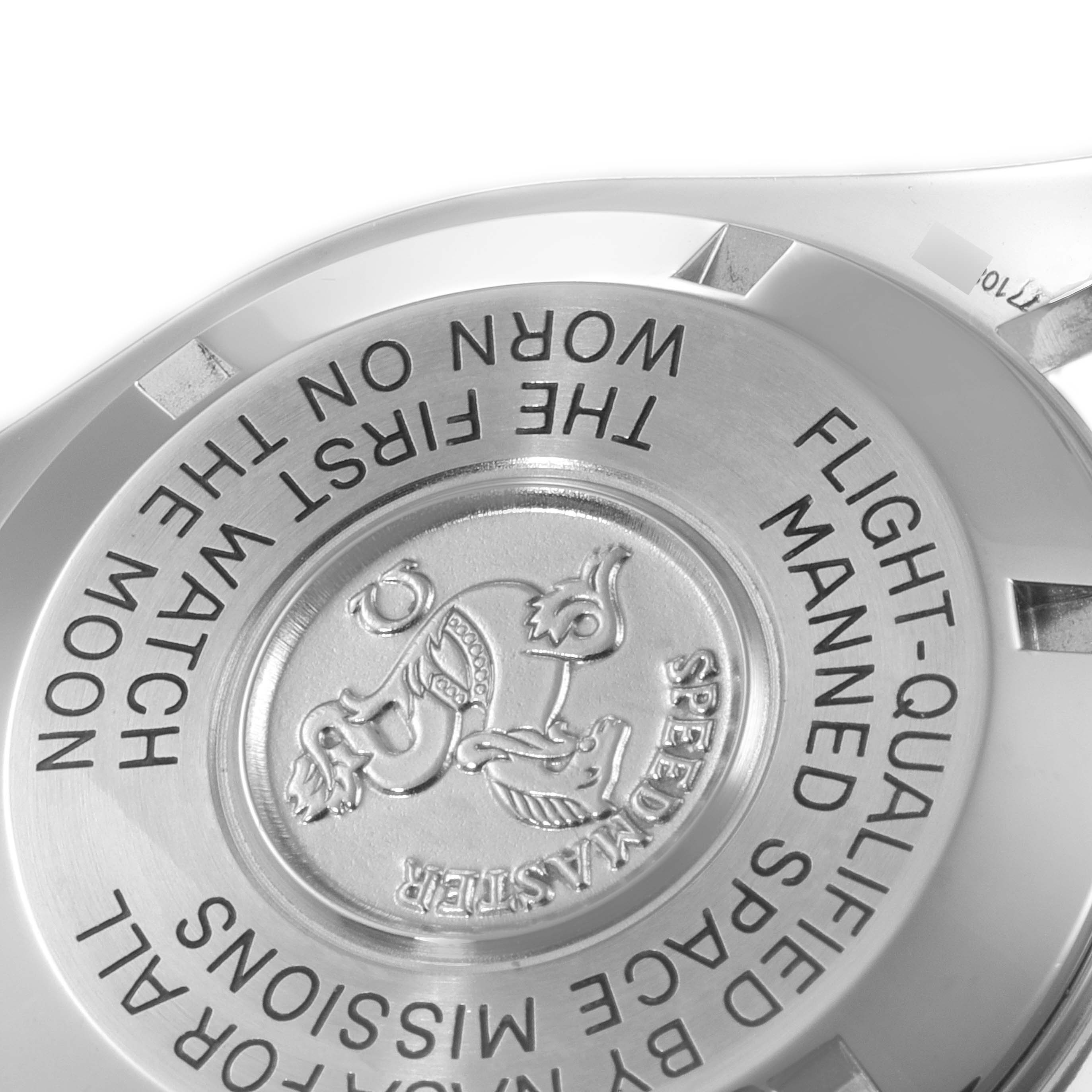 This image shows the case back of the Omega Speedmaster 3570.50.00 Men
s Stainless Steel Black Dial 3570.50.00 Men
s Stainless Steel Black Dial watch with engraved inscriptions.