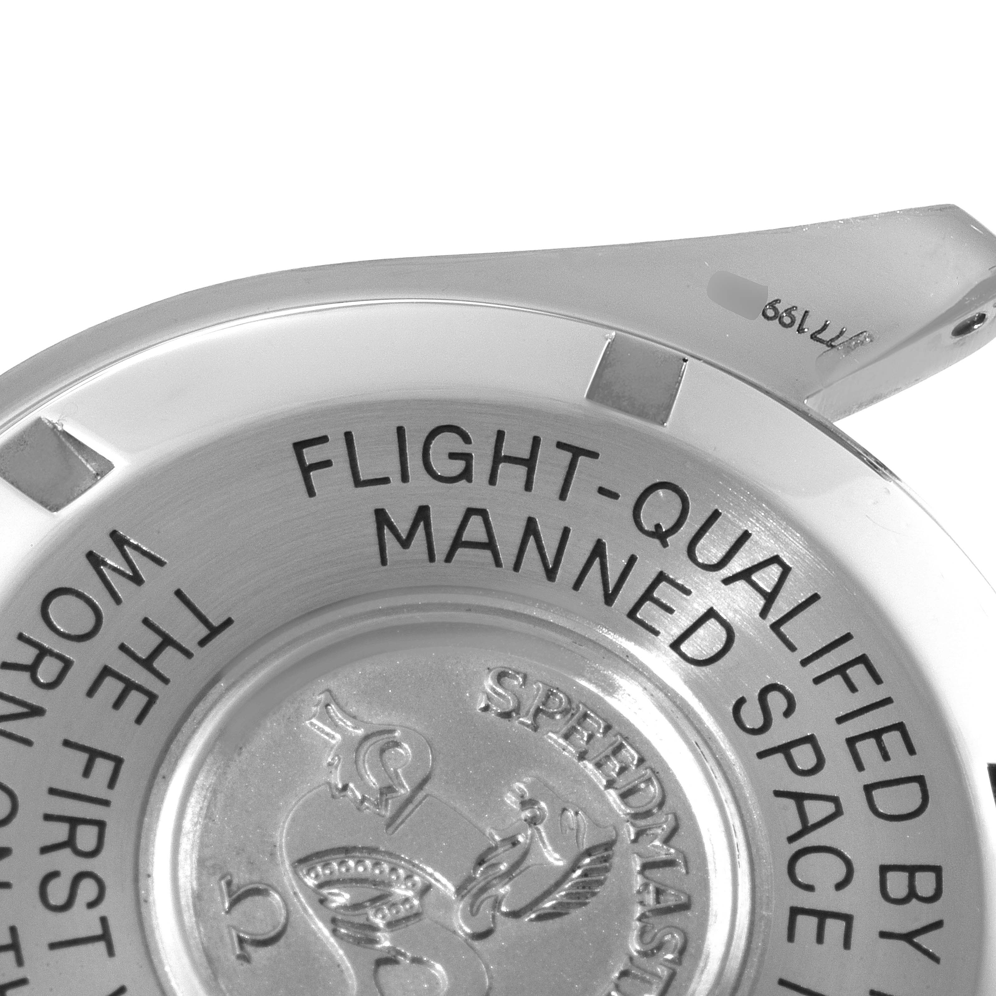 The image shows the case back of the Omega Speedmaster 3570.50.00 Men
s Stainless Steel Black Dial 3570.50.00 Men
s Stainless Steel Black Dial watch, highlighting its engravings and part of the lug.