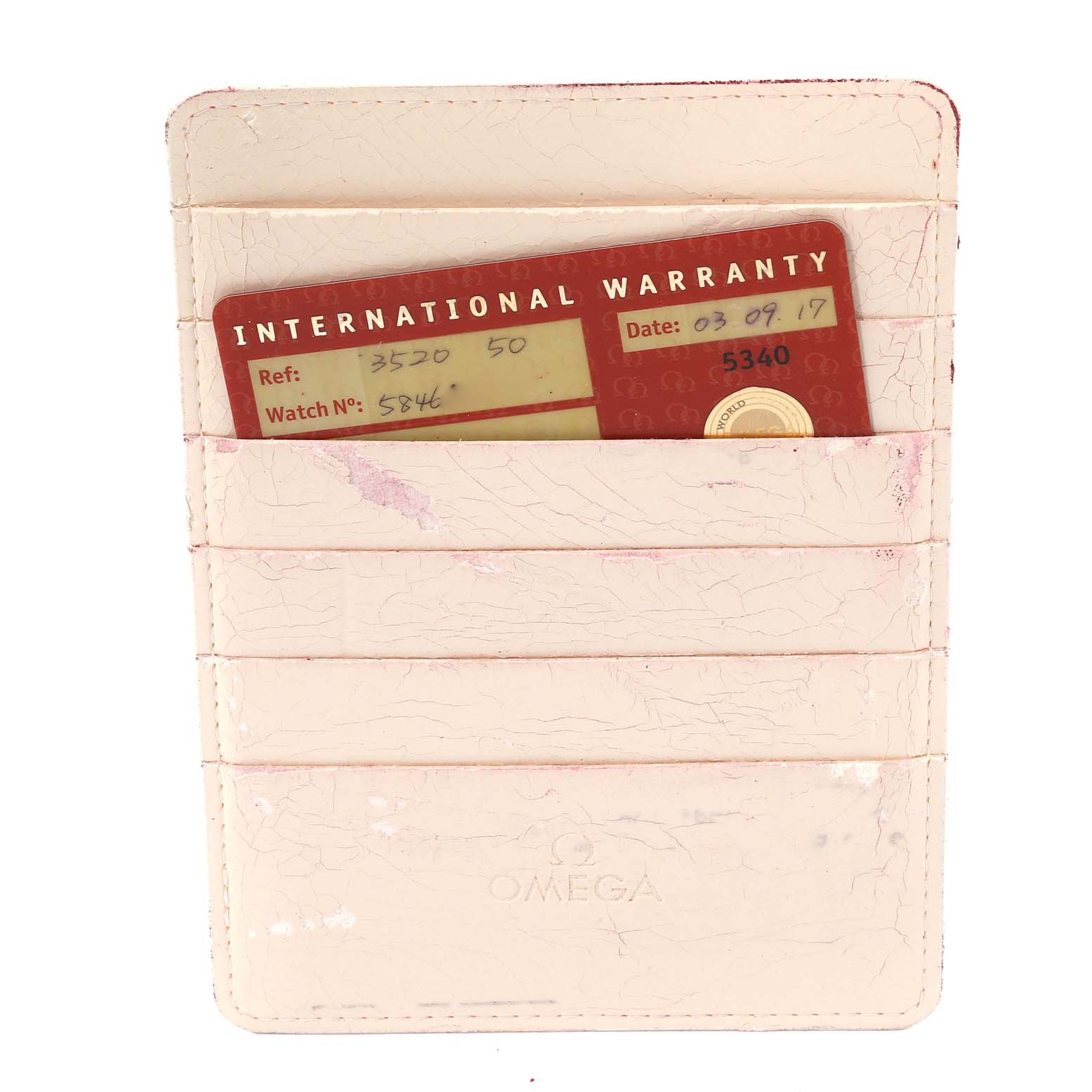 This is a top-down view of the Omega Speedmaster 3520.50.00 Men's Stainless Steel Black Dial 3520.50.00 Men's Stainless Steel Black Dial watch's International Warranty card in a cardholder.