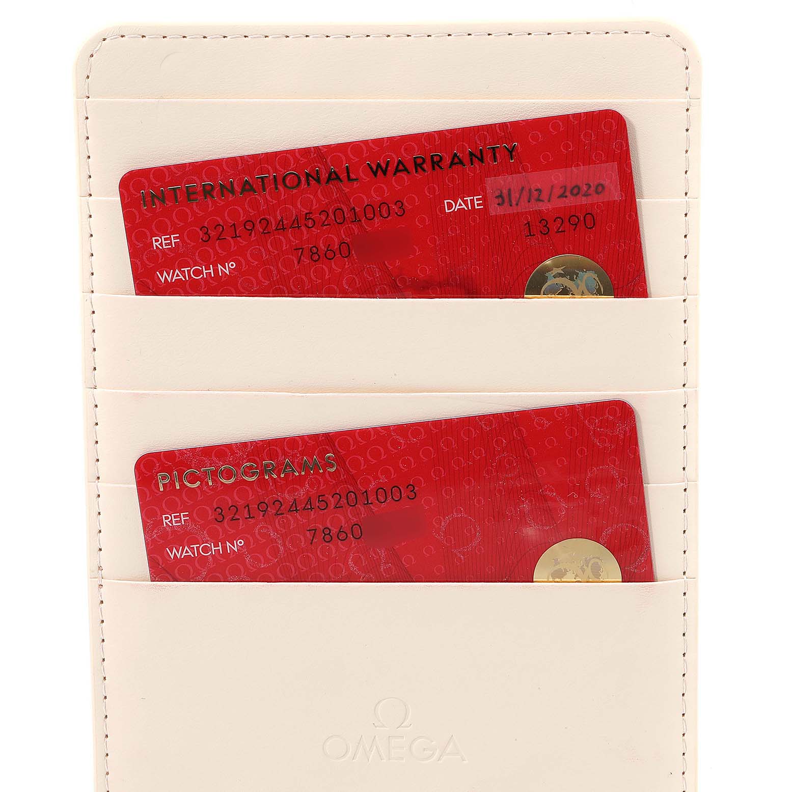 This image shows the international warranty and pictogram cards for the Omega Speedmaster 321.92.44.52.01.003 Men's Titanium Black Dial 321.92.44.52.01.003 Men's Titanium Black Dial, housed in a white cardholder.