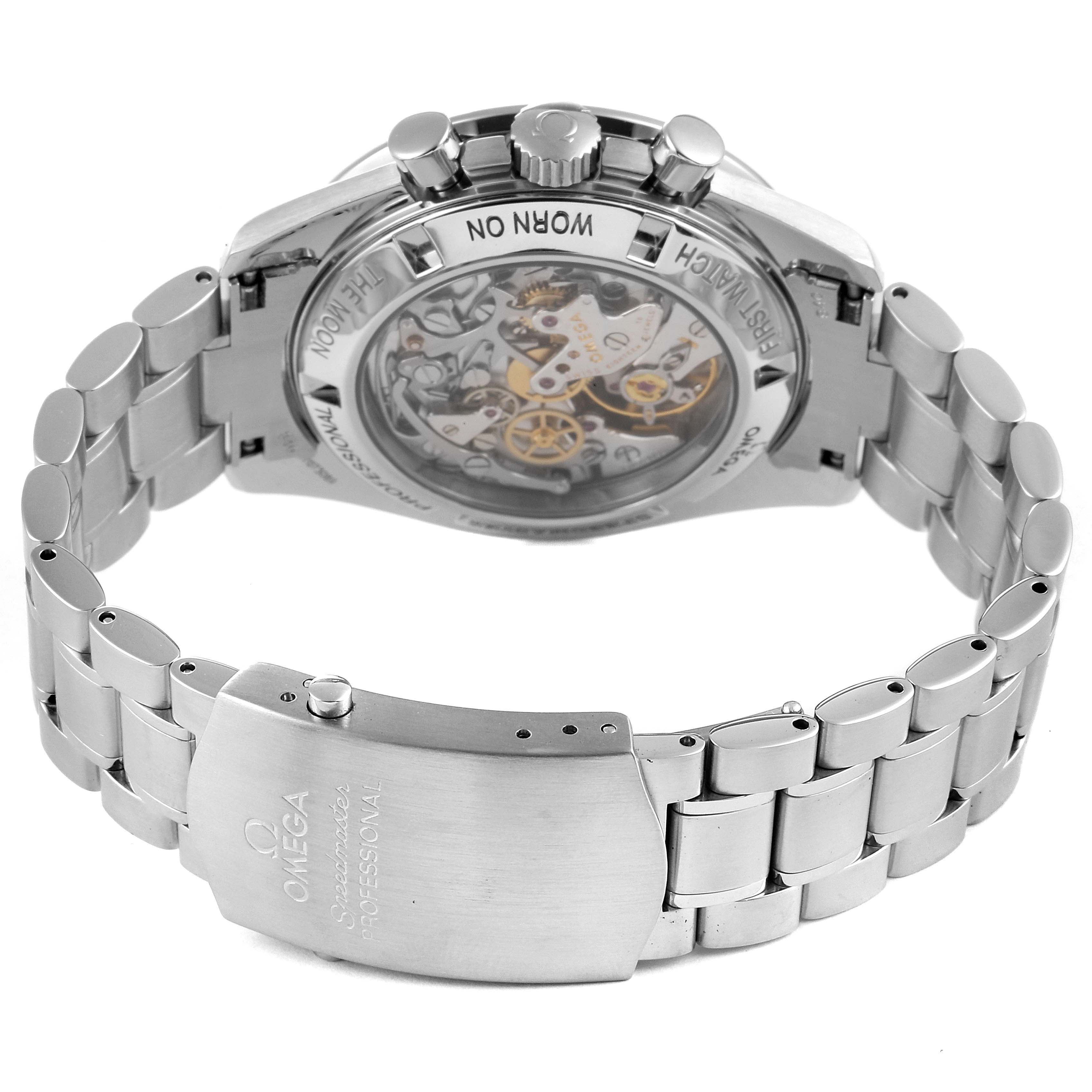The image shows the back and clasp of an Omega Speedmaster 3572.50.00 Men
s Stainless Steel Black Dial 3572.50.00 Men
s Stainless Steel Black Dial watch, highlighting the mechanical movement and bracelet.