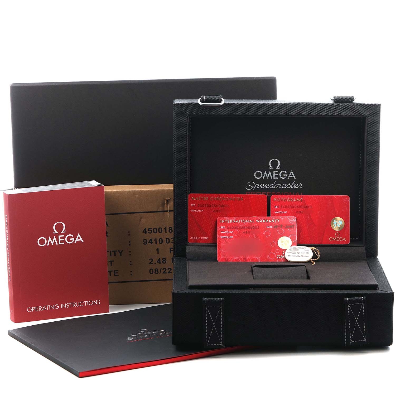 The image shows an Omega Speedmaster 310.30.42.50.04.001 Men's Stainless Steel White Dial box with warranty cards, operating instructions, and packaging materials.