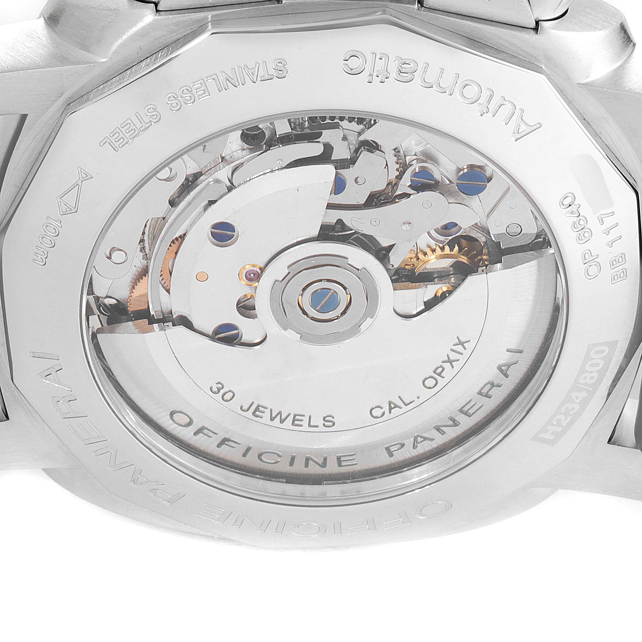 The image shows a close-up view of the transparent case back of a Panerai Luminor PAM00212 Men's Stainless Steel Black Dial PAM00212 Men's Stainless Steel Black Dial, revealing the intricate mechanical movement inside.