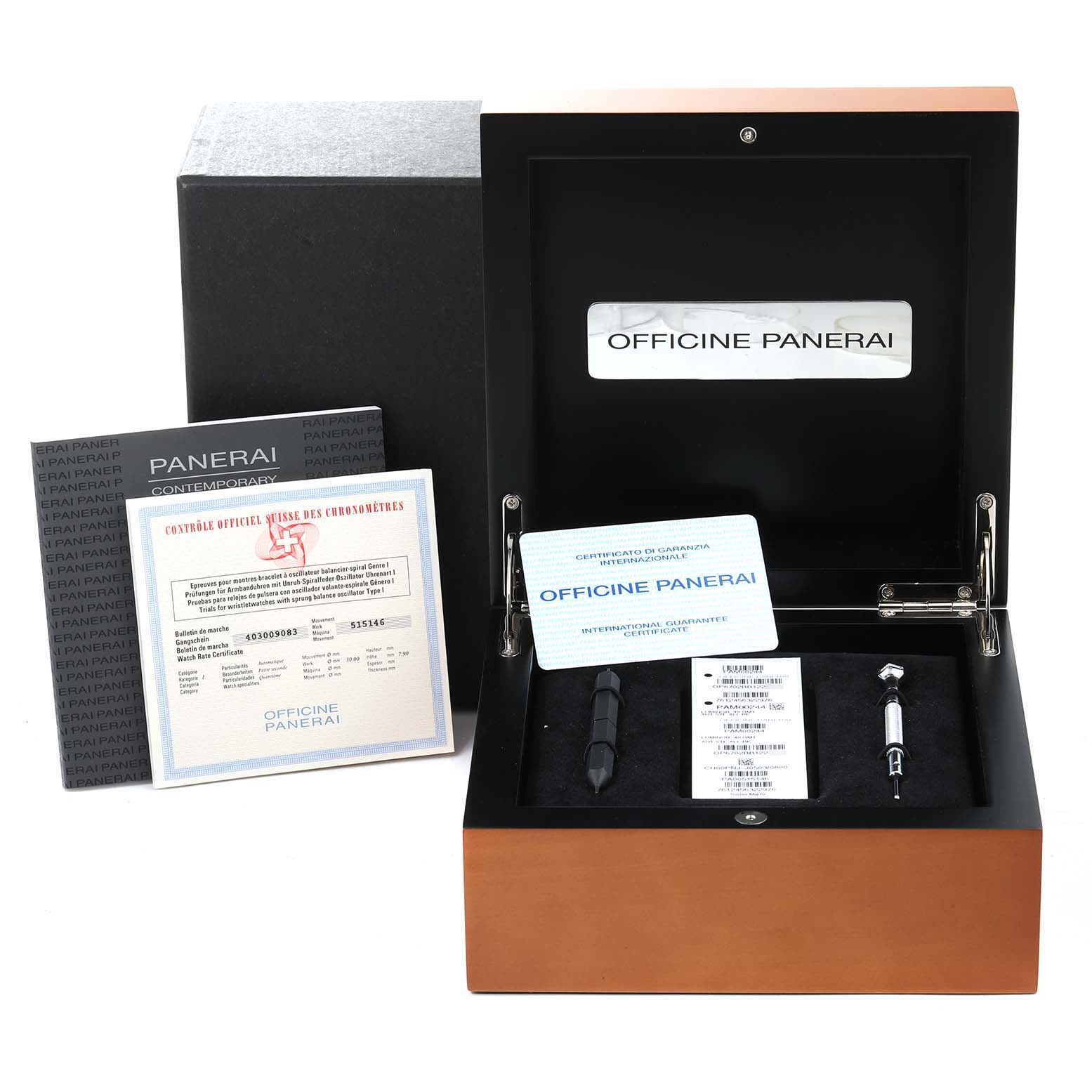 This image shows packaging and accessories of a Panerai Luminor PAM00244 Men
s Stainless Steel Black Dial PAM00244 Men
s Stainless Steel Black Dial watch, including an open box and certificates.