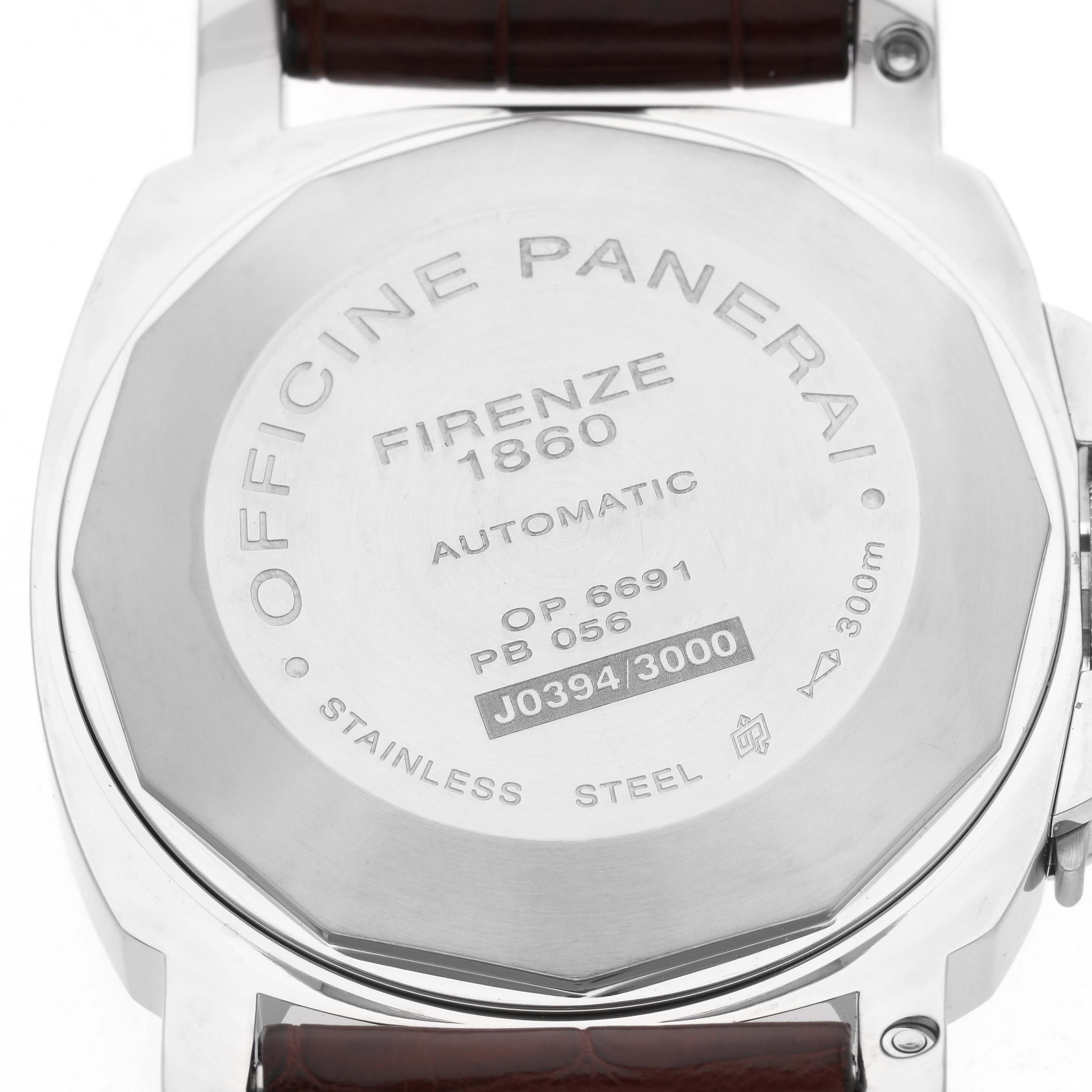 The image shows the stainless steel case back of a Panerai Luminor PAM00088 Men
s Stainless Steel Black Dial PAM00088 Men
s Stainless Steel Black Dial watch, featuring engravings and a strap attachment.