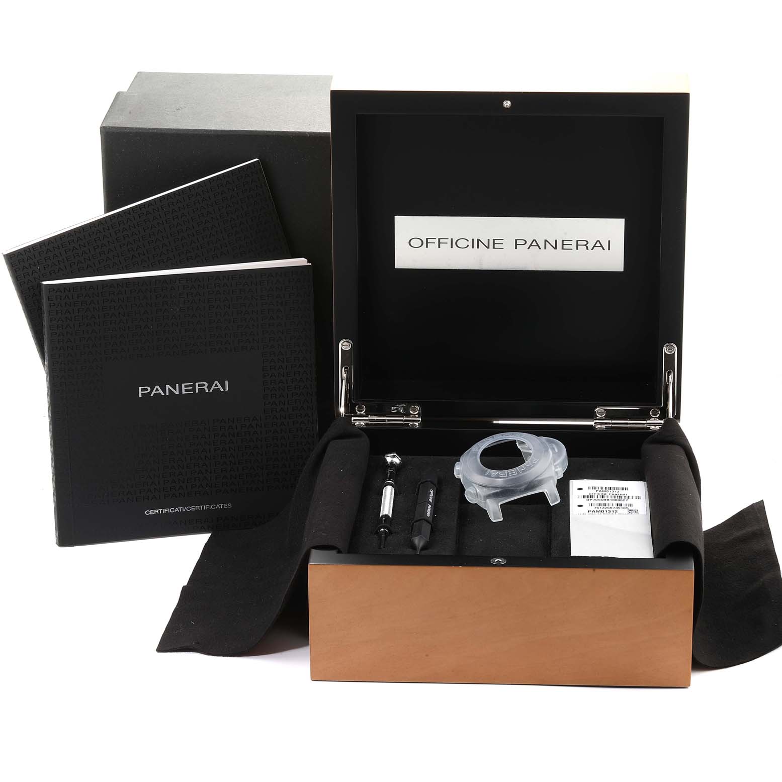 This image shows the box, manuals, and accessories for the Luminor model by Panerai from a top-down angle.