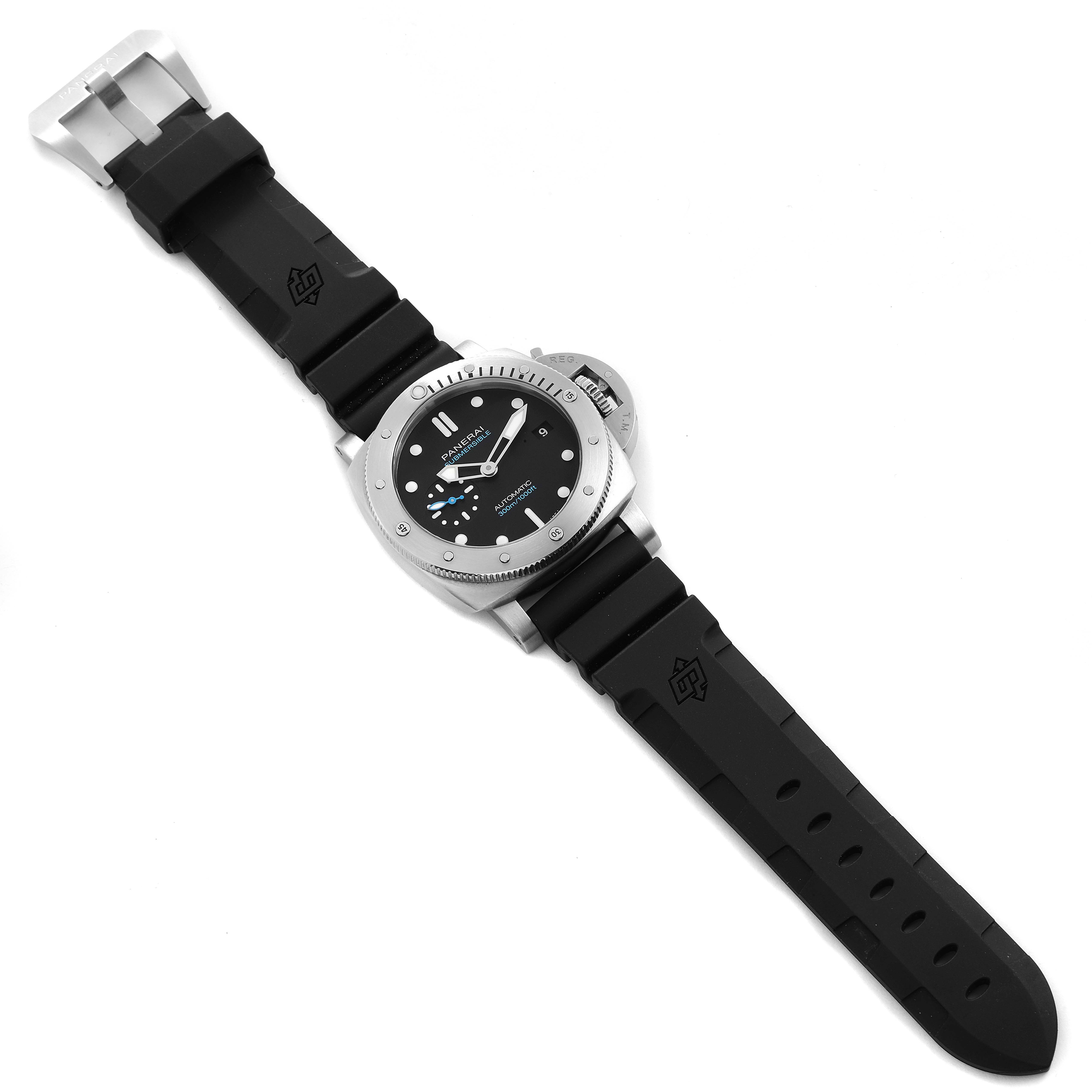 The Panerai Submersible PAM00973 Men's Stainless Steel Black Dial PAM00973 Men's Stainless Steel Black Dial watch is shown flat, displaying the face, bezel, lugs, and black rubber strap fully extended.