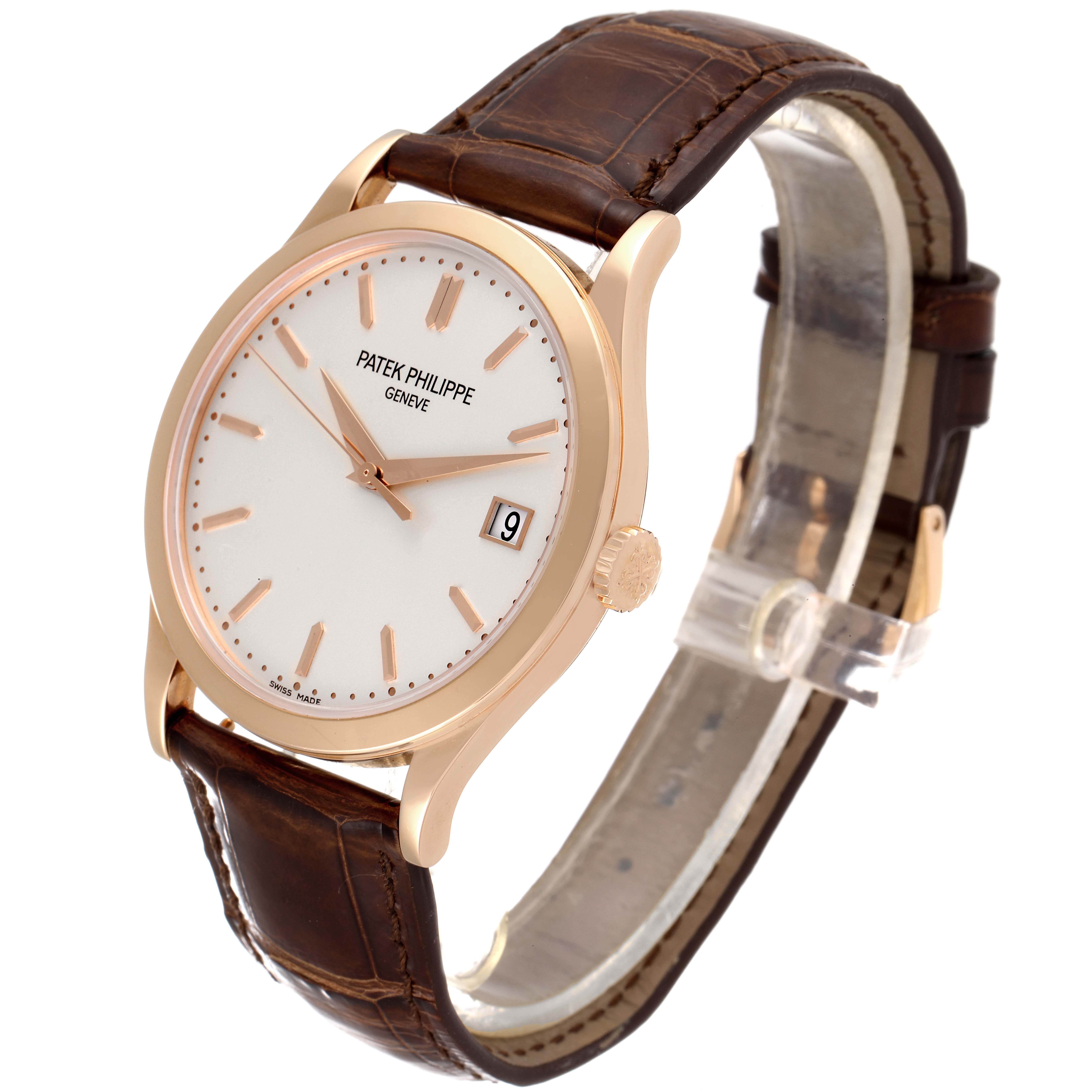 This image shows a Patek Philippe Calatrava 5296R-010 Men
s Rose Gold Silver Dial 5296R-010 Men
s Rose Gold Silver Dial watch from an angled front view, displaying the dial, case, and brown leather strap.