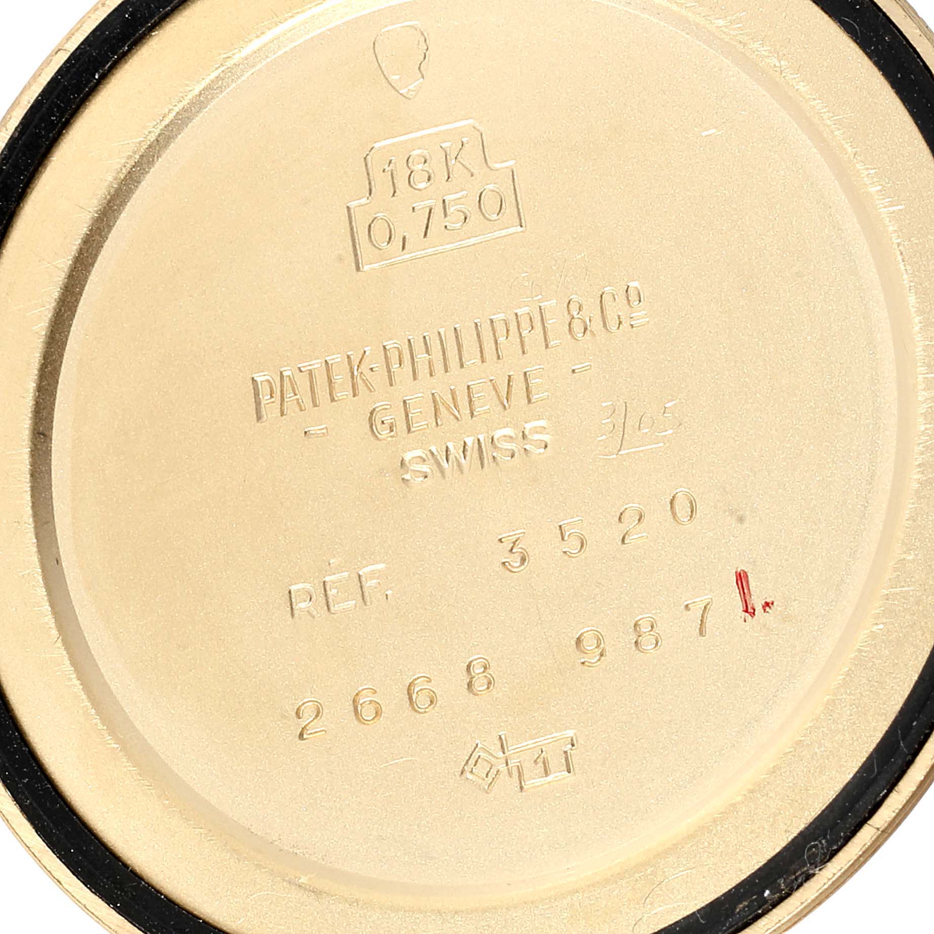 The image shows the backside of a Patek Philippe Calatrava 3520 Men's Yellow Gold White Dial 3520 Men's Yellow Gold White Dial watch case, displaying inscriptions and reference numbers.