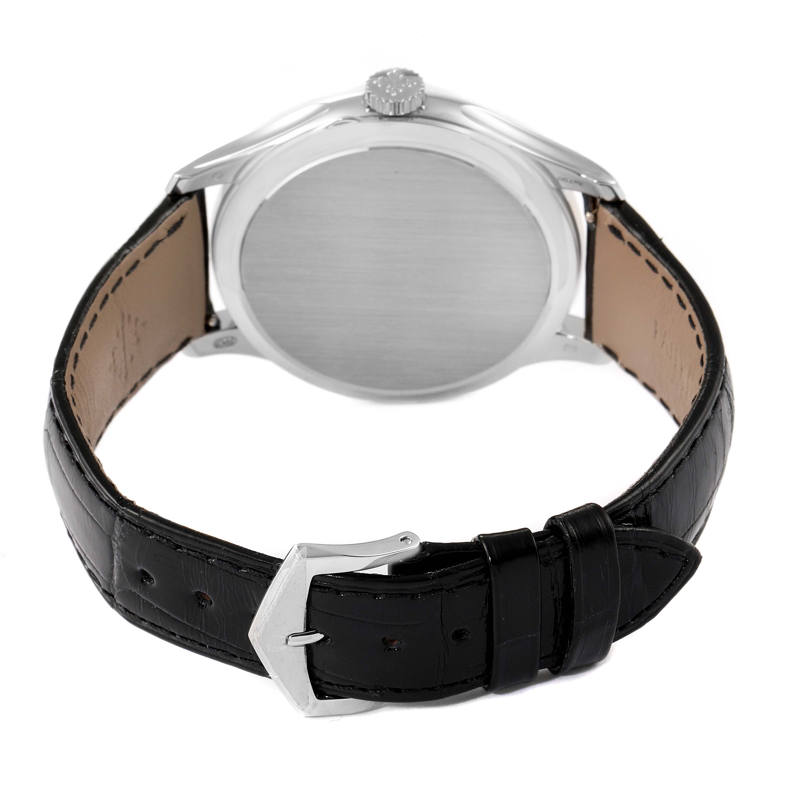 The image shows the backside view of a Patek Philippe Calatrava 5227G Men
s White Gold Black Dial 5227G Men
s White Gold Black Dial watch, displaying the clasp and leather strap.