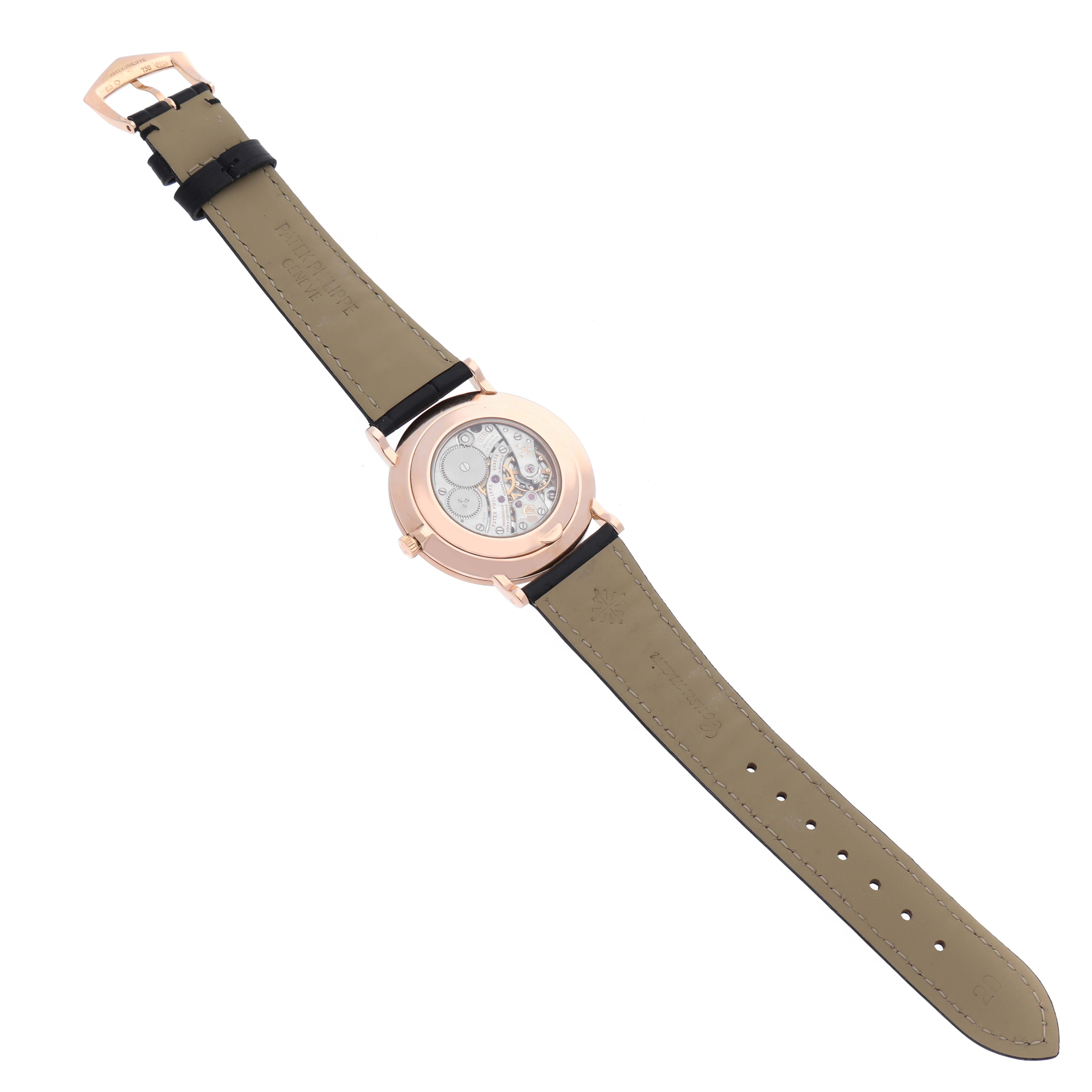 This image shows the back view of a Calatrava model by Patek Philippe, highlighting the watch's open case back and strap.