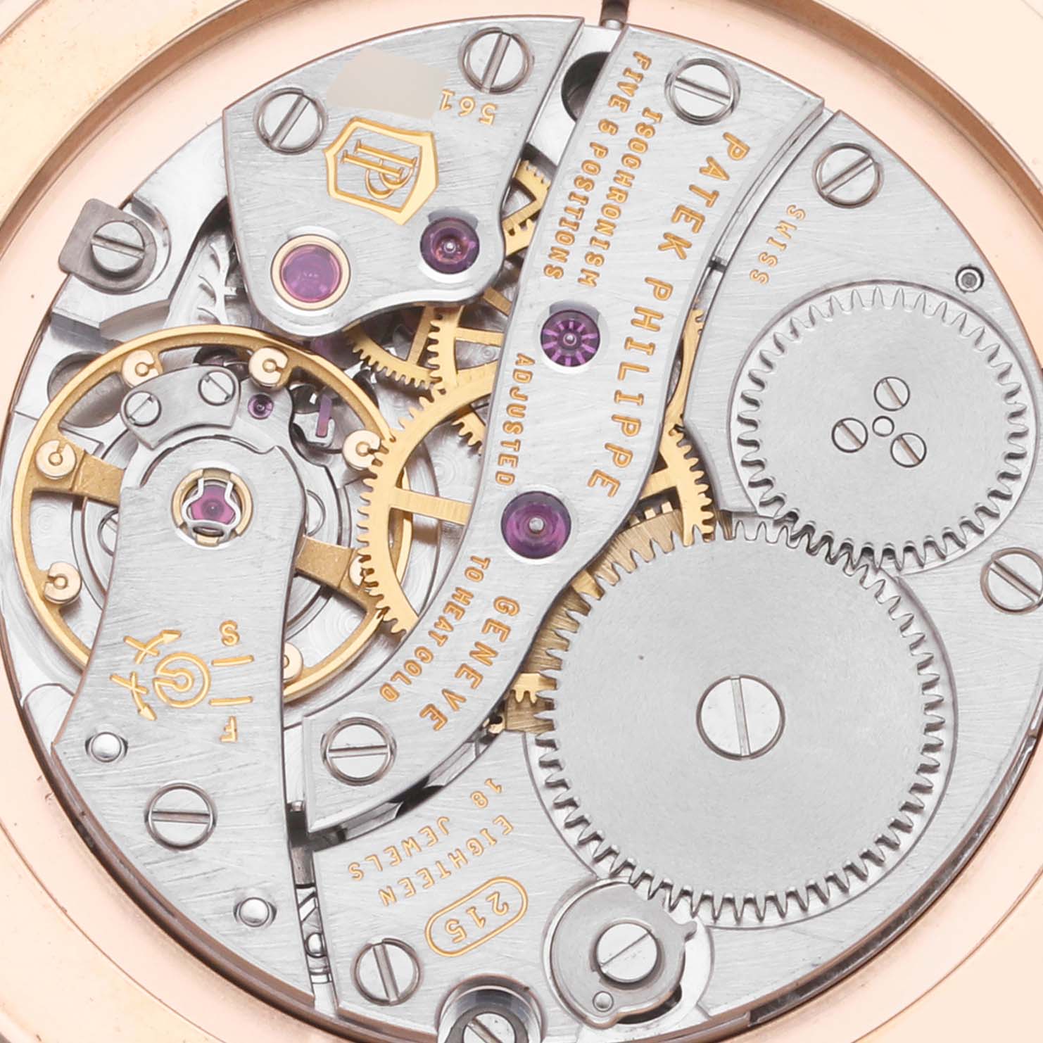 The image shows a close-up of the movement mechanism of a Patek Philippe Calatrava 5119R Men's Rose Gold White Dial 5119R Men's Rose Gold White Dial watch.