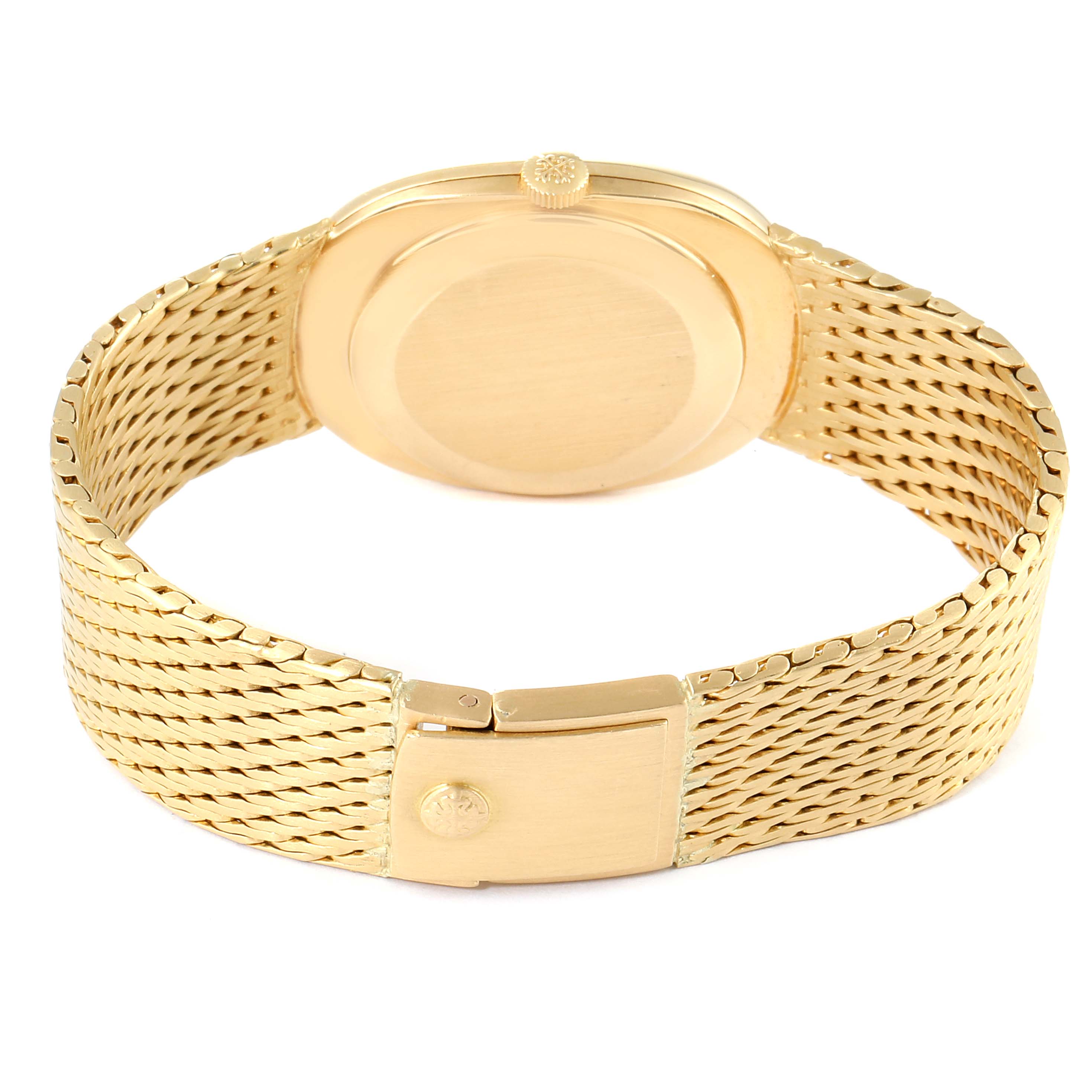 The image shows the back view of a Patek Philippe Golden Ellipse 3548 Women
s Yellow Gold Blue Dial 3548 Women
s Yellow Gold Blue Dial watch, highlighting its clasp, case back, and crown.