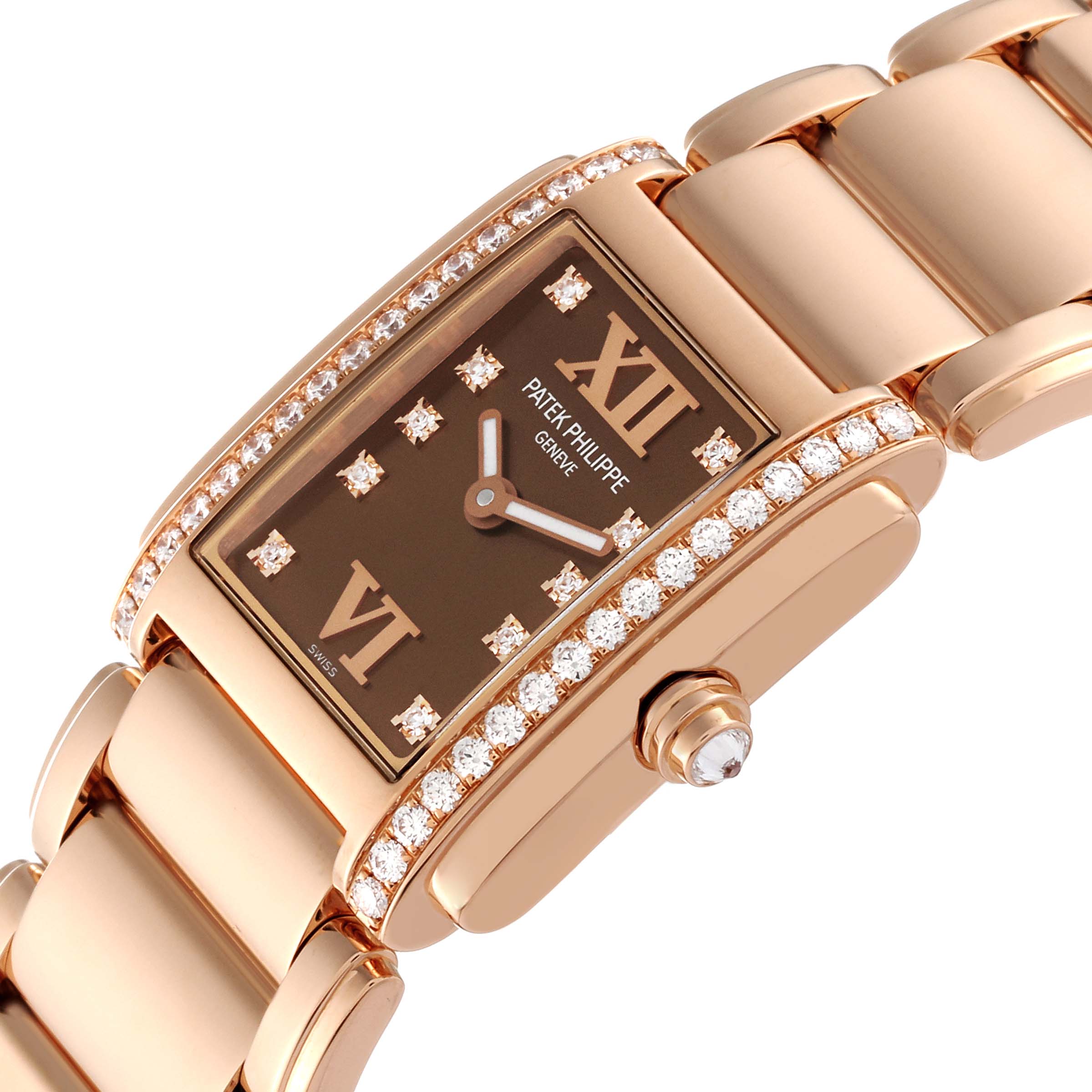 The image shows a close-up of the Patek Philippe Twenty-4 4908/11R-010 Women's Rose Gold Brown Dial 4908/11R-010 Women's Rose Gold Brown Dial watch from a diagonal angle, highlighting the diamond-set case and brown dial.
