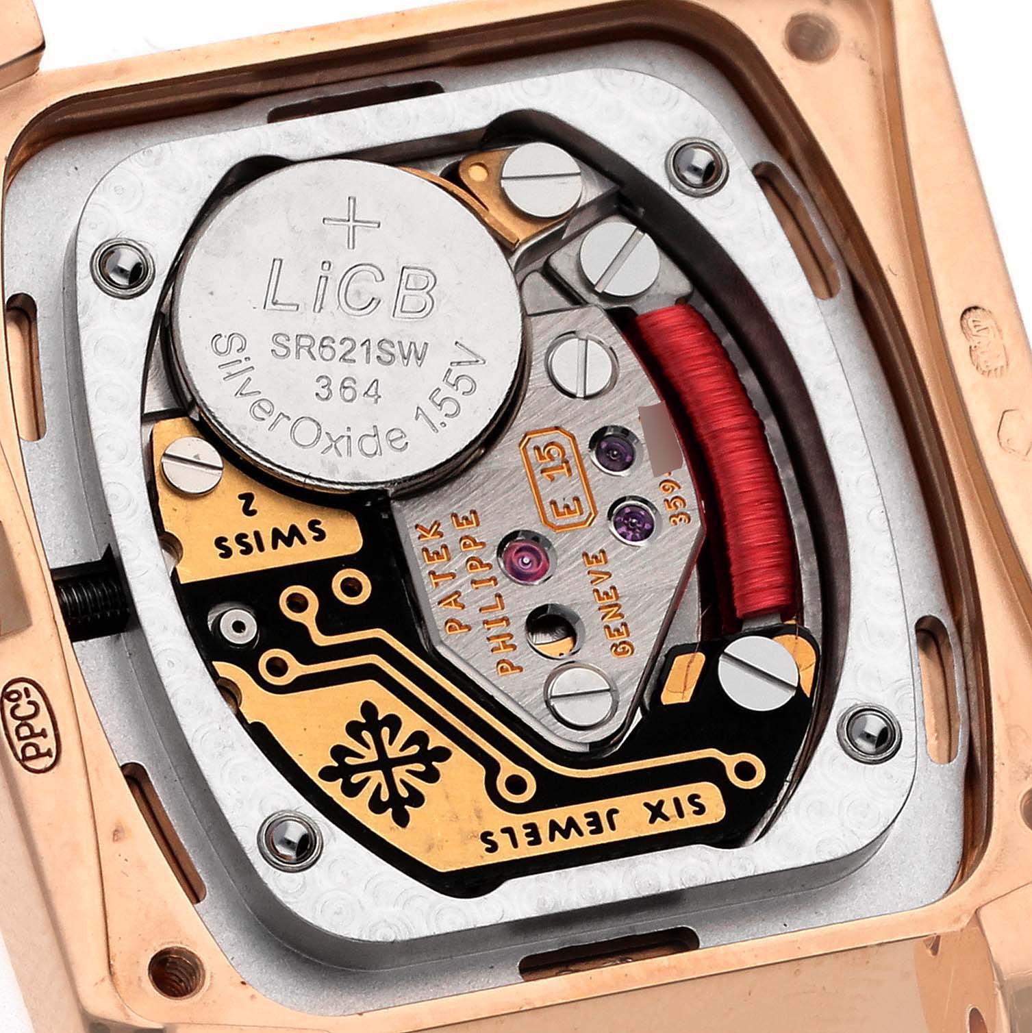 The image shows the internal mechanism and battery compartment of a Patek Philippe Twenty-4 4908/11R-010 Women's Rose Gold Brown Dial 4908/11R-010 Women's Rose Gold Brown Dial watch.