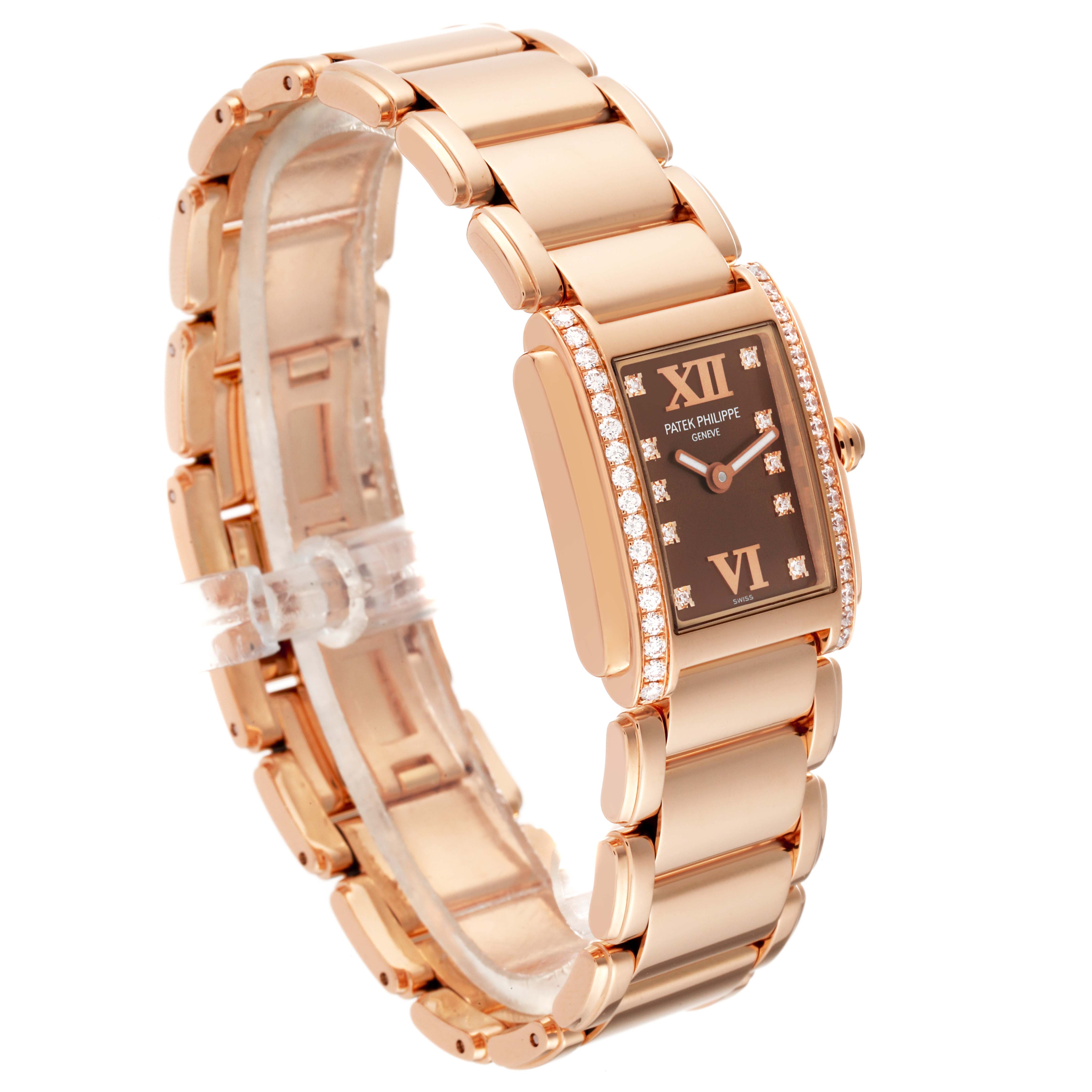 The image shows a Patek Philippe Twenty-4 4908/11R-010 Women's Rose Gold Brown Dial 4908/11R-010 Women's Rose Gold Brown Dial watch at an angled side view, featuring its bracelet, case, and diamond-studded bezel.