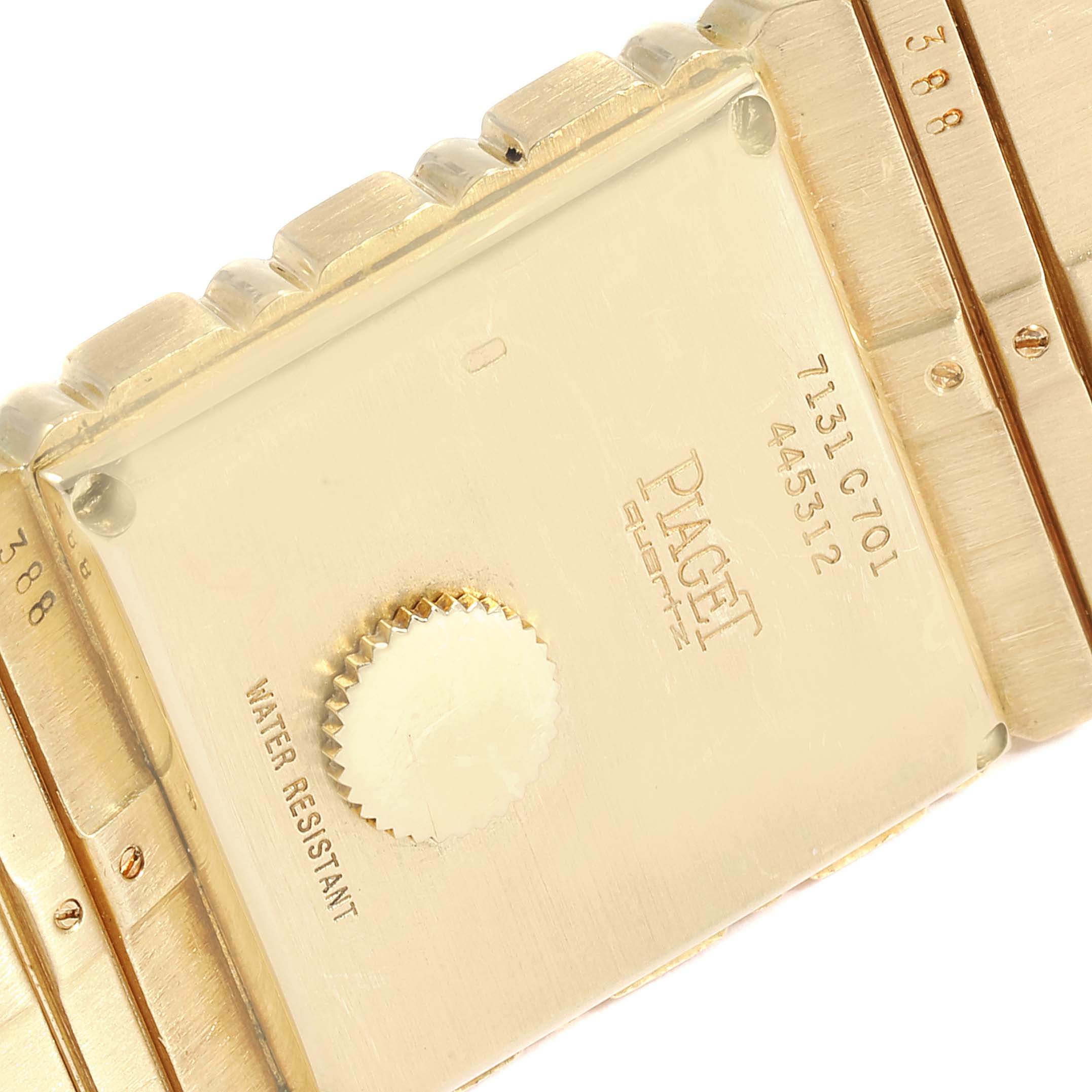The image shows the back view of a Piaget 7131 C 701 Men's Yellow Gold Champagne Dial 7131 C 701 Men's Yellow Gold Champagne Dial Polo 18K Yellow Gold Men's Watch 7131 model, highlighting the case back, crown, and part of the bracelet.
