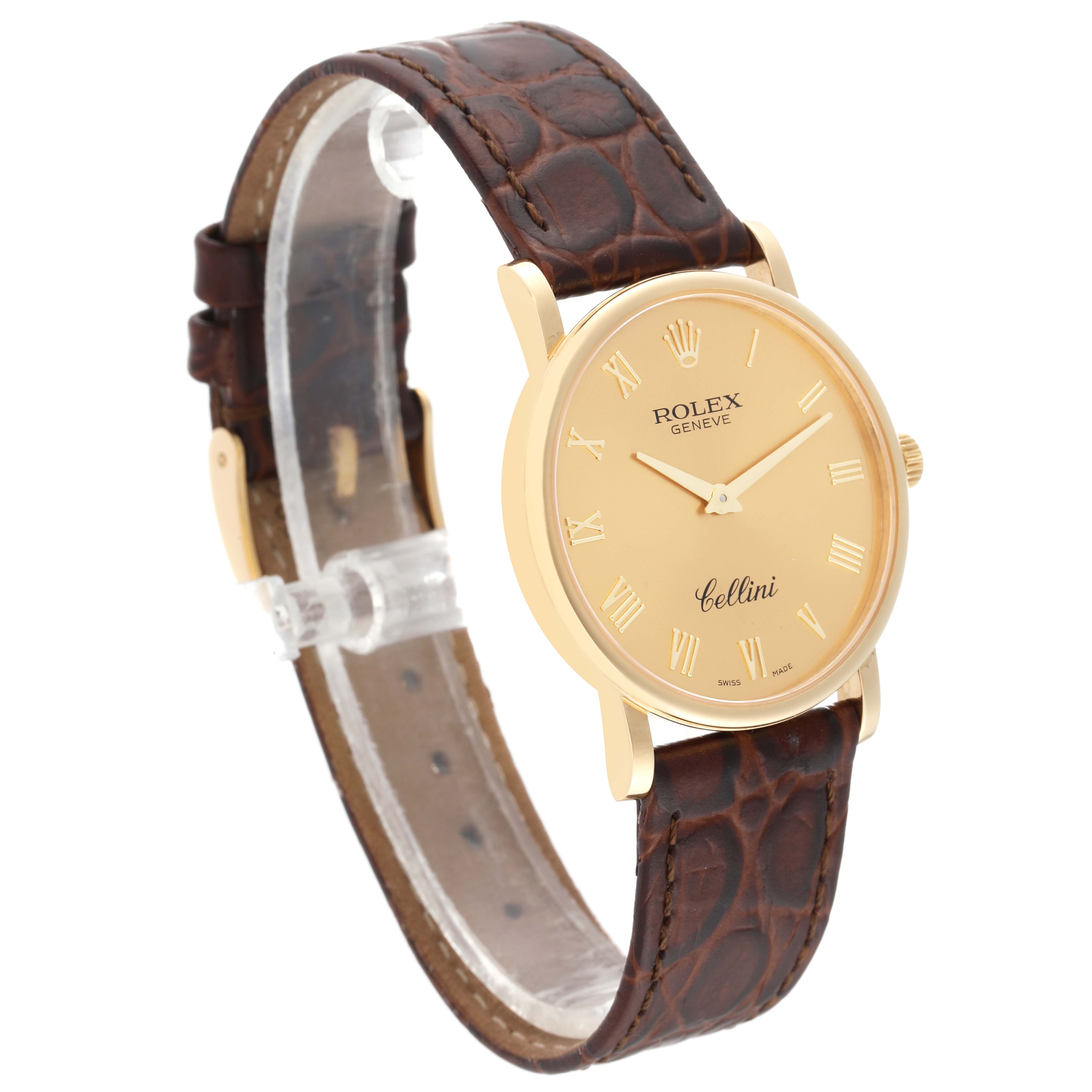 The Rolex Cellini 5115/8 Men's Yellow Gold Champagne Dial 5115/8 Men's Yellow Gold Champagne Dial watch is shown at an angle displaying its gold case, dial with Roman numerals, and brown leather strap.