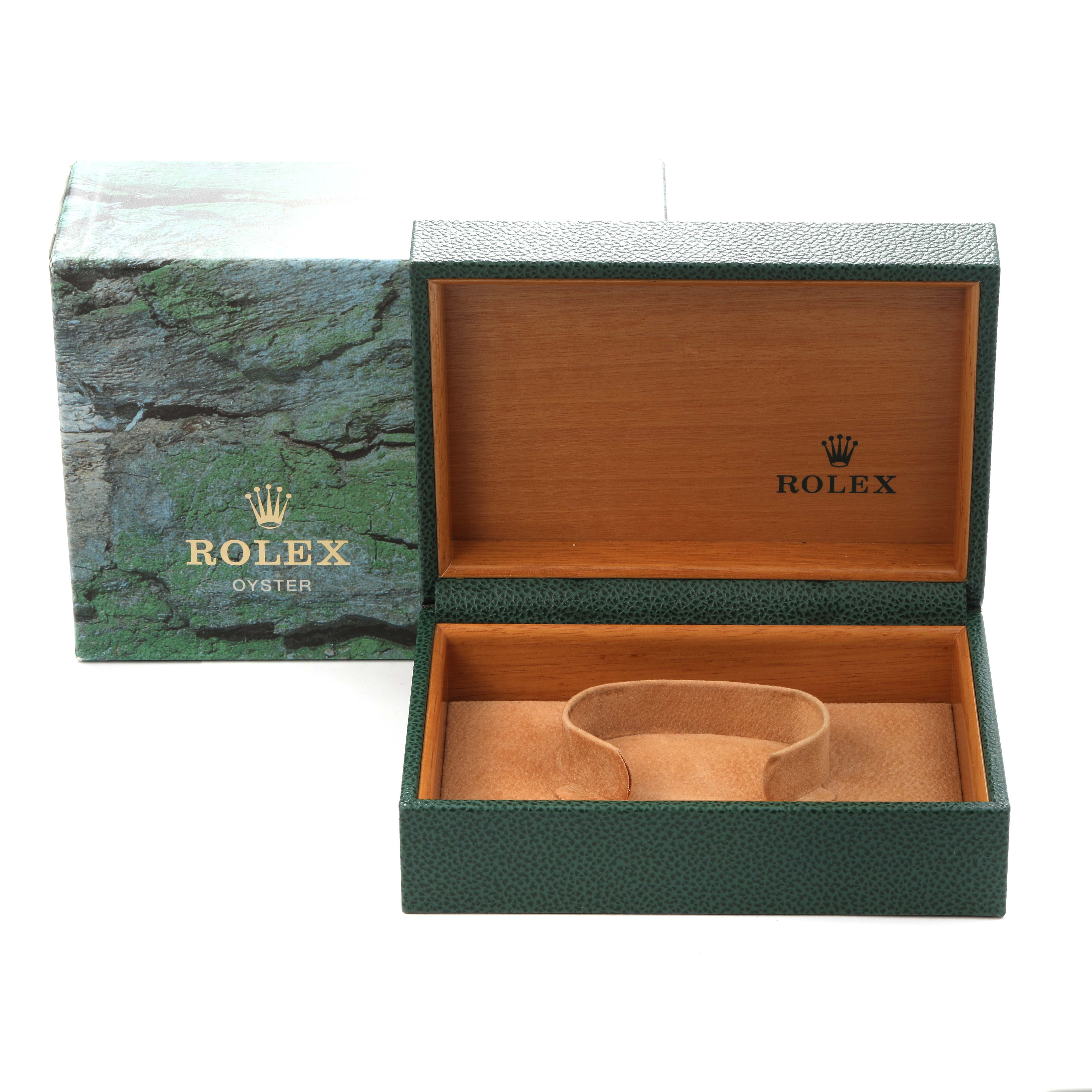 The image shows the open box of a Rolex Date 15200 Men
s Stainless Steel White Dial 15200 Men
s Stainless Steel White Dial model, featuring its green and brown exterior and interior design without the watch.