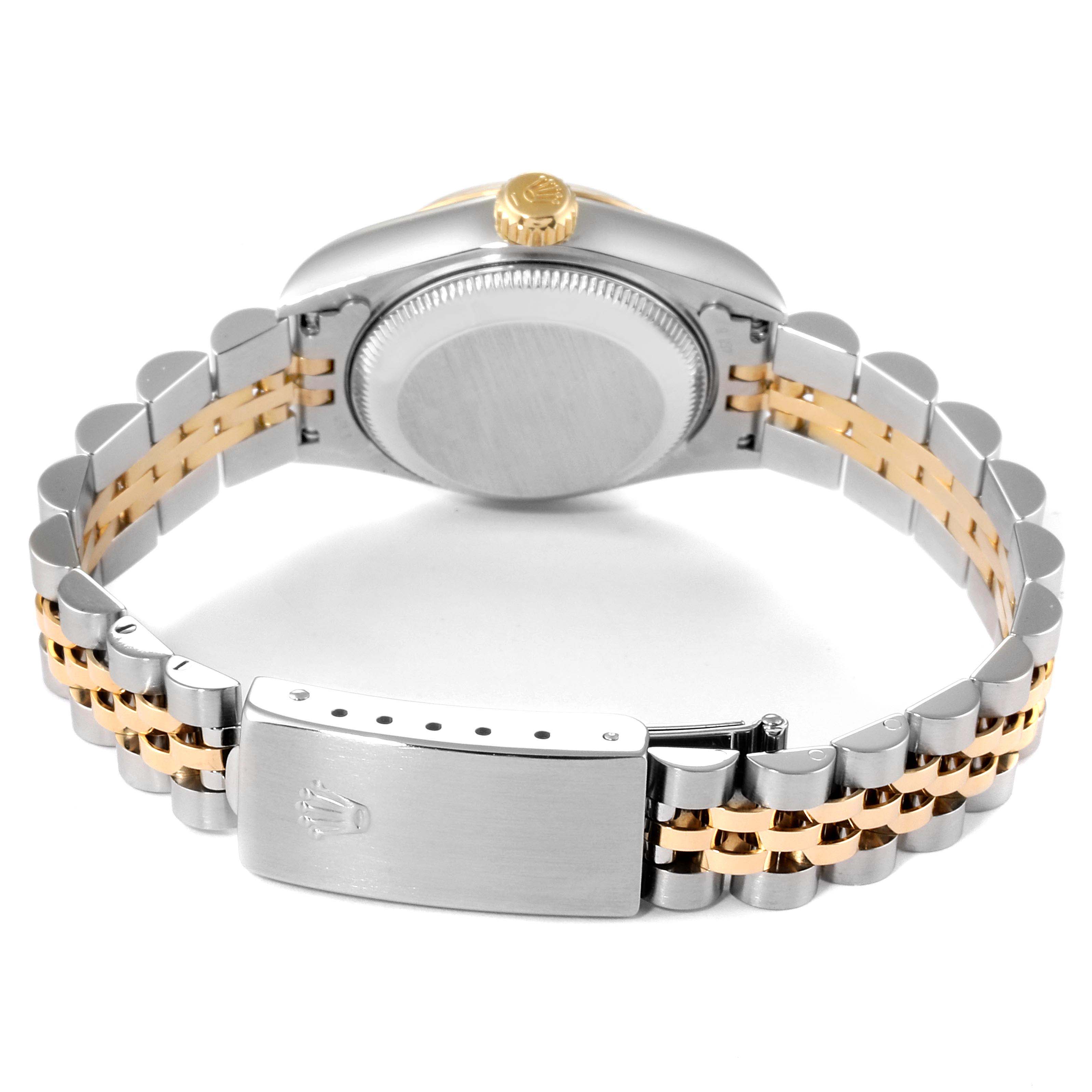 The image shows the back of a Rolex Datejust 69173 Women
s Steel and Gold (two tone) Champagne Dial 69173 Women
s Steel and Gold (two tone) Champagne Dial watch, highlighting its case back, crown, and Jubilee bracelet with a clasp.