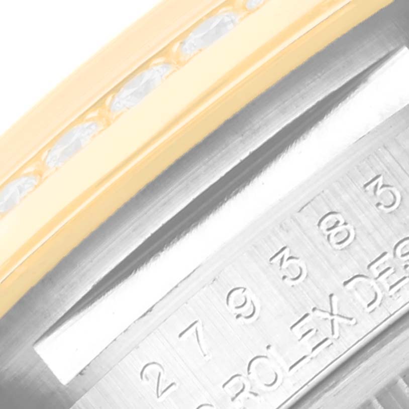The image shows a close-up of the bezel and part of the engraving of a Rolex Datejust 279383 Women's Steel and Gold (two tone) Silver Dial 279383 Women's Steel and Gold (two tone) Silver Dial watch.