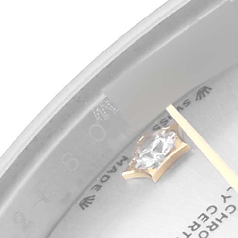 Close-up angled view of the Rolex Datejust 279383 Women's Steel and Gold (two tone) Silver Dial 279383 Women's Steel and Gold (two tone) Silver Dial watch face, showing a diamond hour marker and part of the minute hand.