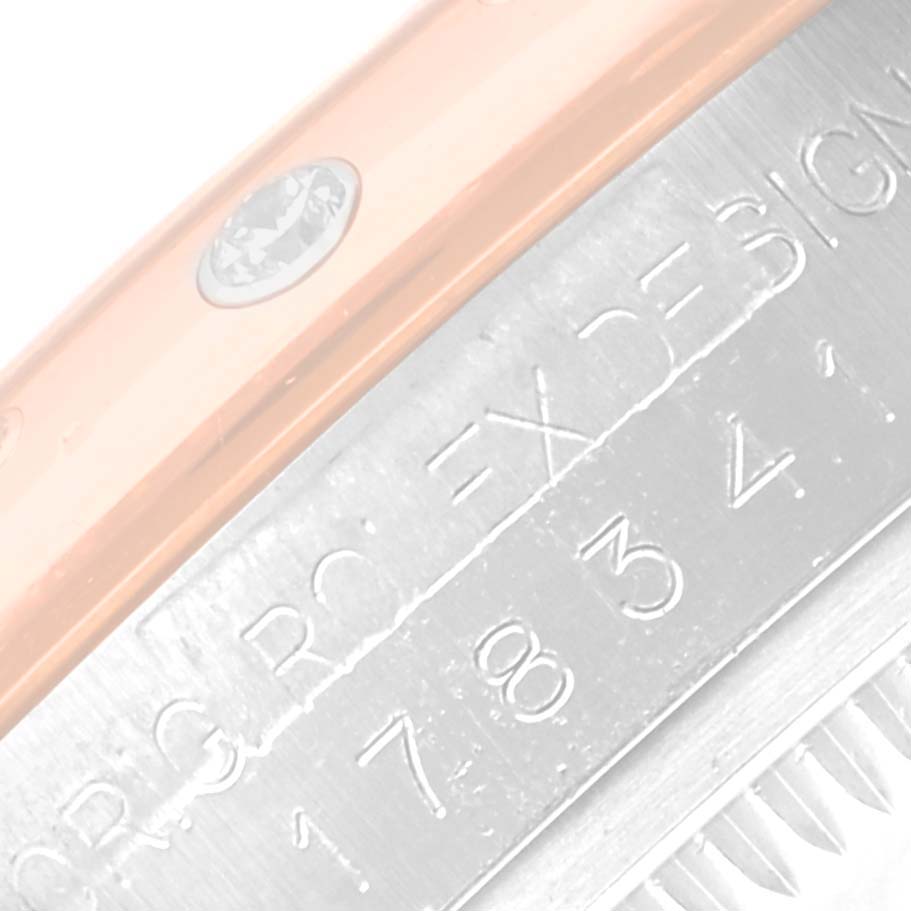 This image shows a close-up of the side of a Rolex Mid-Size 178341 Women's Steel and Gold (two tone) Purple Dial 178341 Women's Steel and Gold (two tone) Purple Dial model watch, focusing on the edge of the bezel and part of the case.