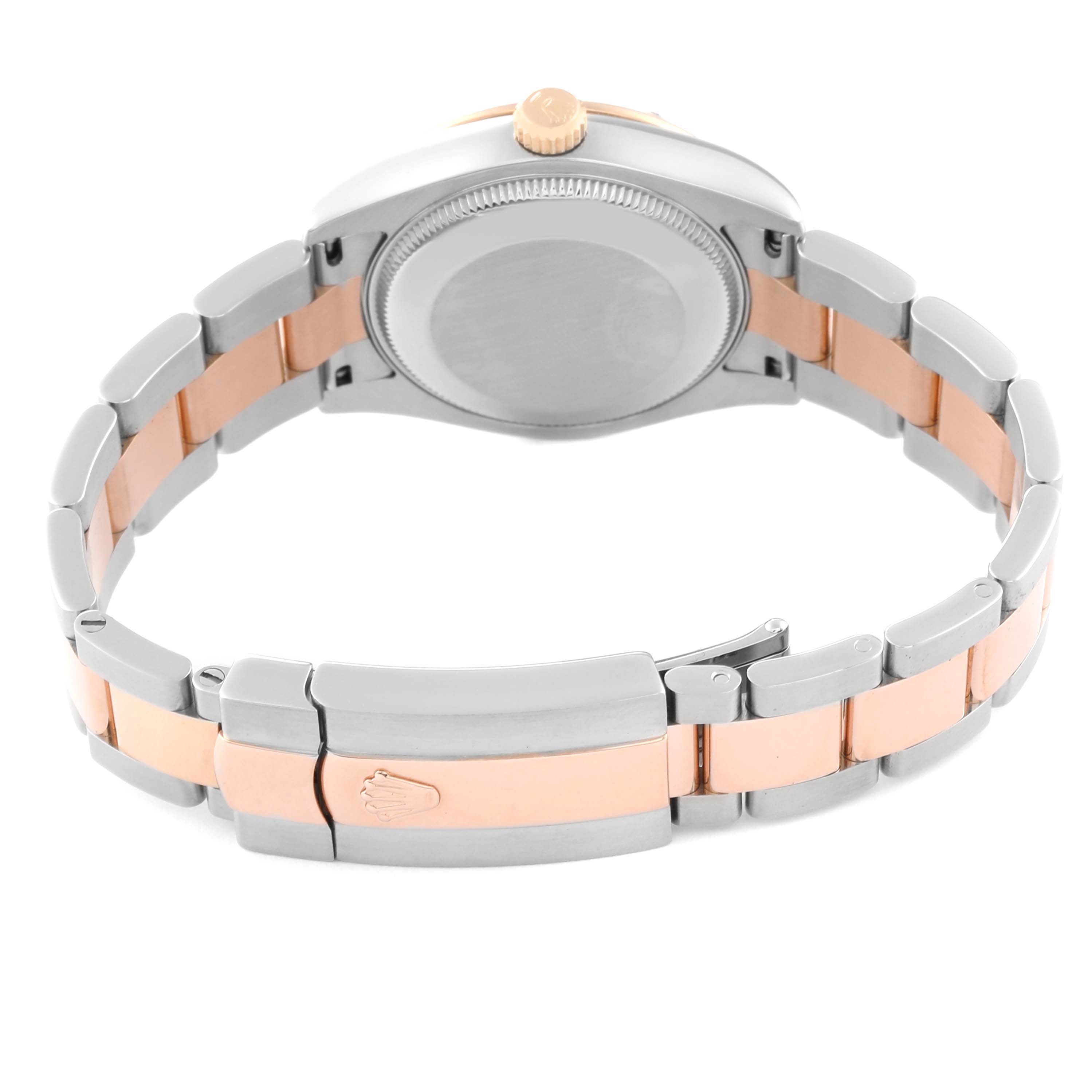 The image shows the back view of a Mid-Size Rolex watch, highlighting its case back, crown, two-tone bracelet, and clasp.