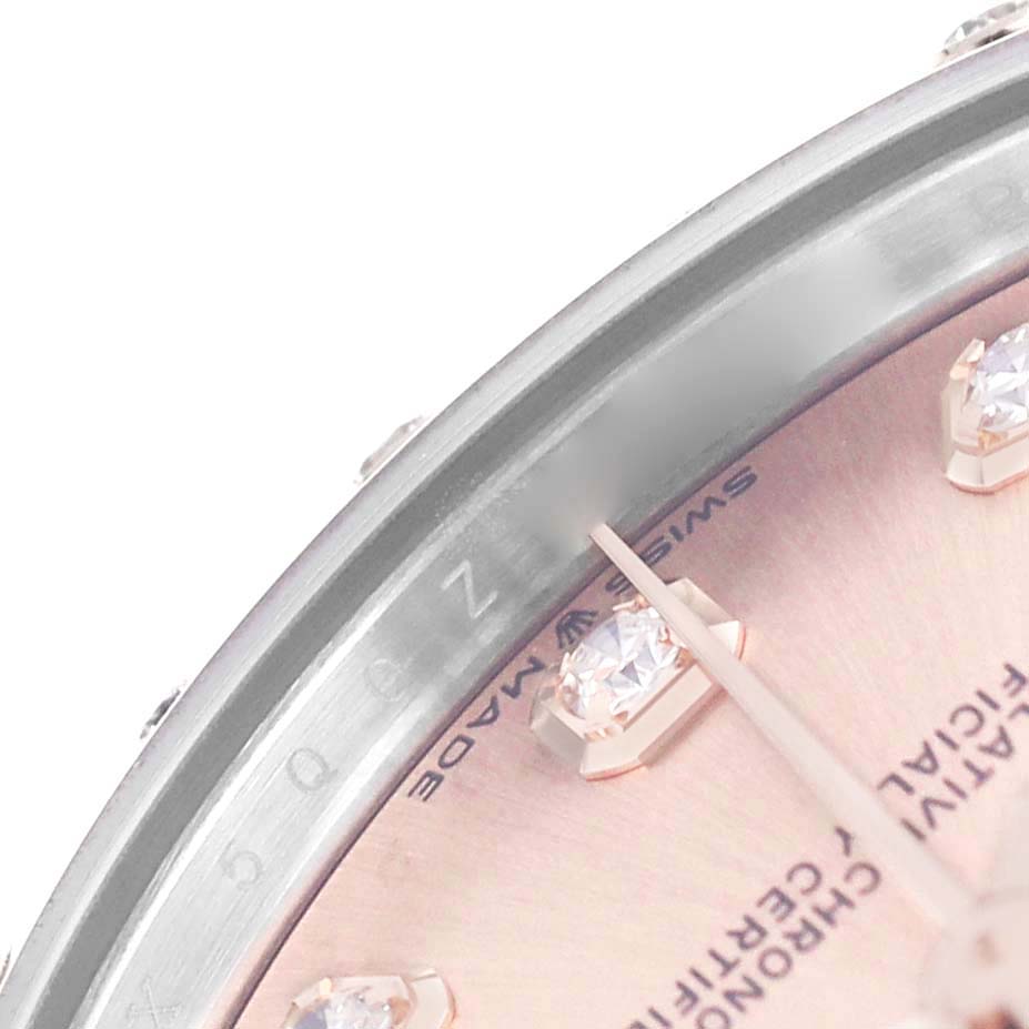 The image shows a close-up of the dial, bezel, and partial hands of the Rolex Mid-Size 278341RBR Women's Stainless Steel Pink Dial watch, focusing on the details and markings.