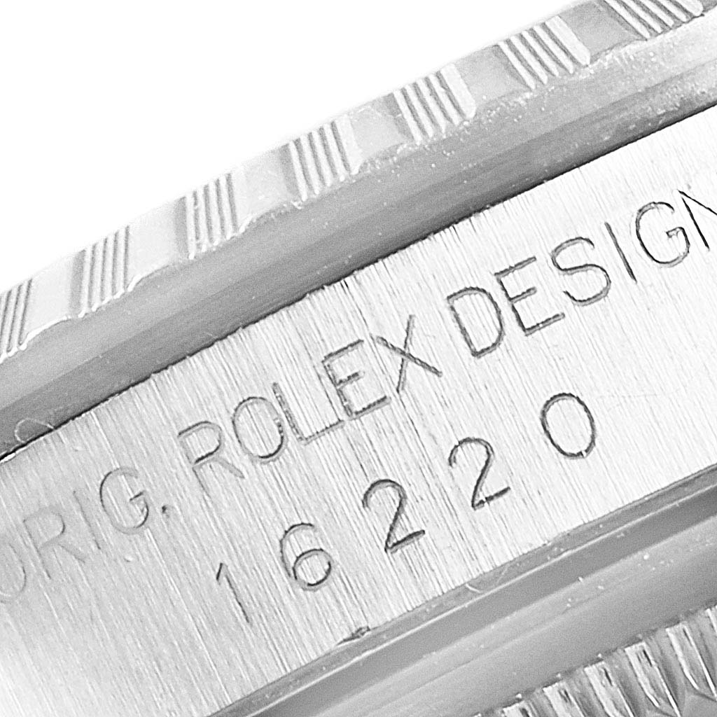This close-up image shows the rehaut with engravings and the fluted bezel of a Rolex Datejust 16220 Men
s Stainless Steel Black Dial 16220 Men
s Stainless Steel Black Dial watch.