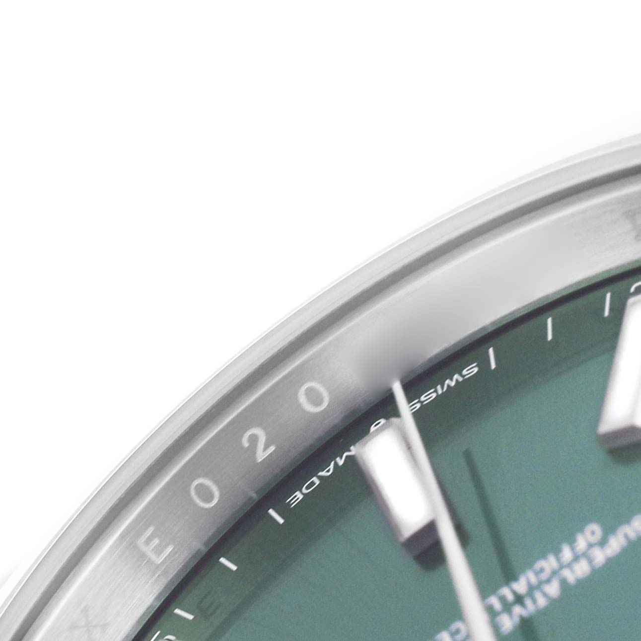 The image shows a close-up of the dial, bezel, and markers of the Rolex Datejust 41 126300 Men's Stainless Steel Green Dial watch.