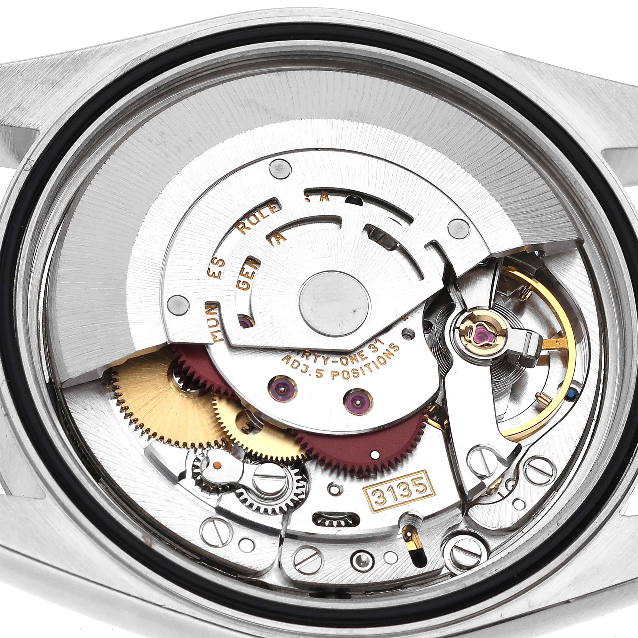 The image shows a close-up view of the movement inside the Rolex Datejust 16234 Men's Stainless Steel Black Dial 16234 Men's Stainless Steel Black Dial, highlighting its intricate gears and components.