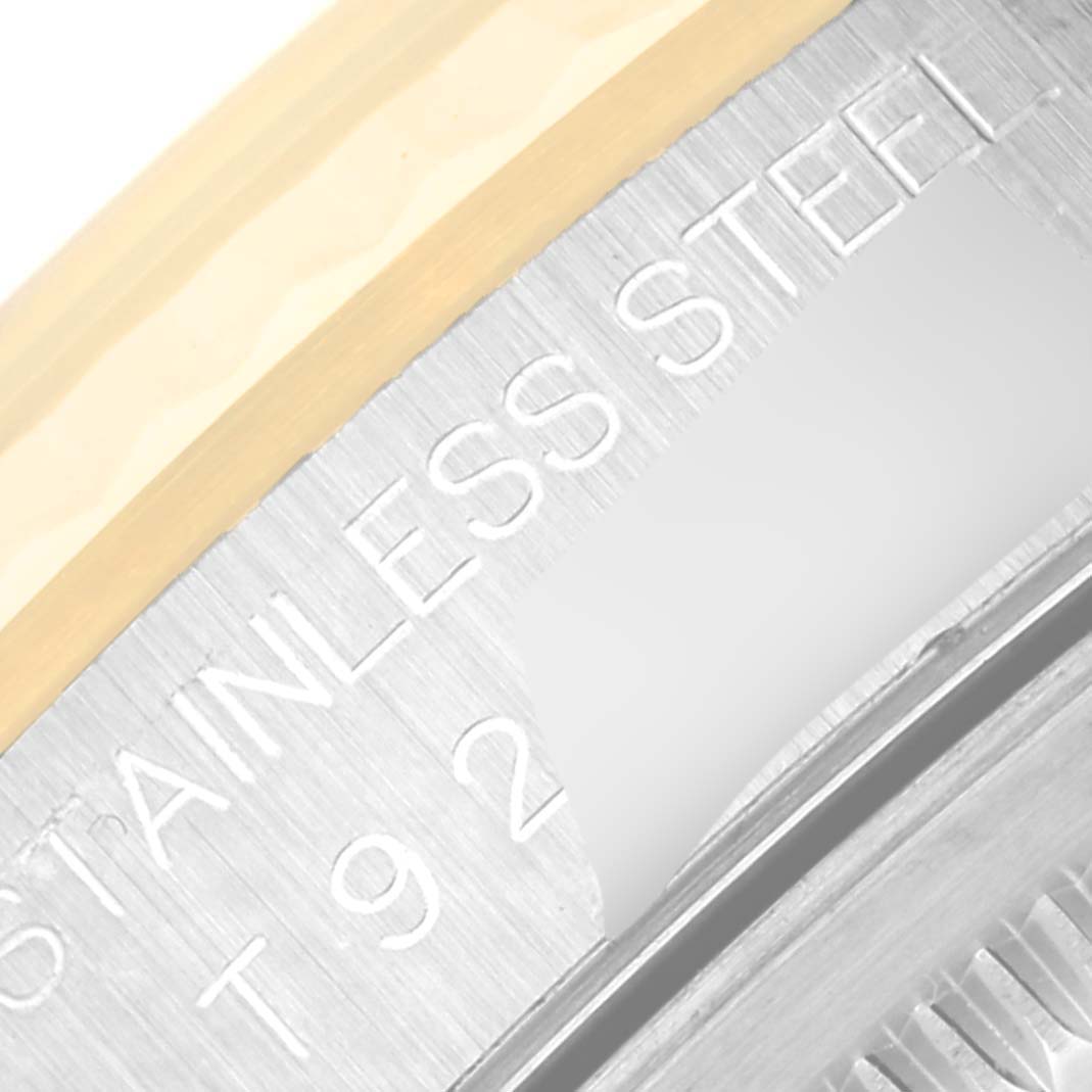 This image shows a close-up view of the inner bezel and part of the engravings on a Rolex Datejust 16233 Men's Steel and Gold (two tone) Champagne Dial 16233 Men's Steel and Gold (two tone) Champagne Dial watch.