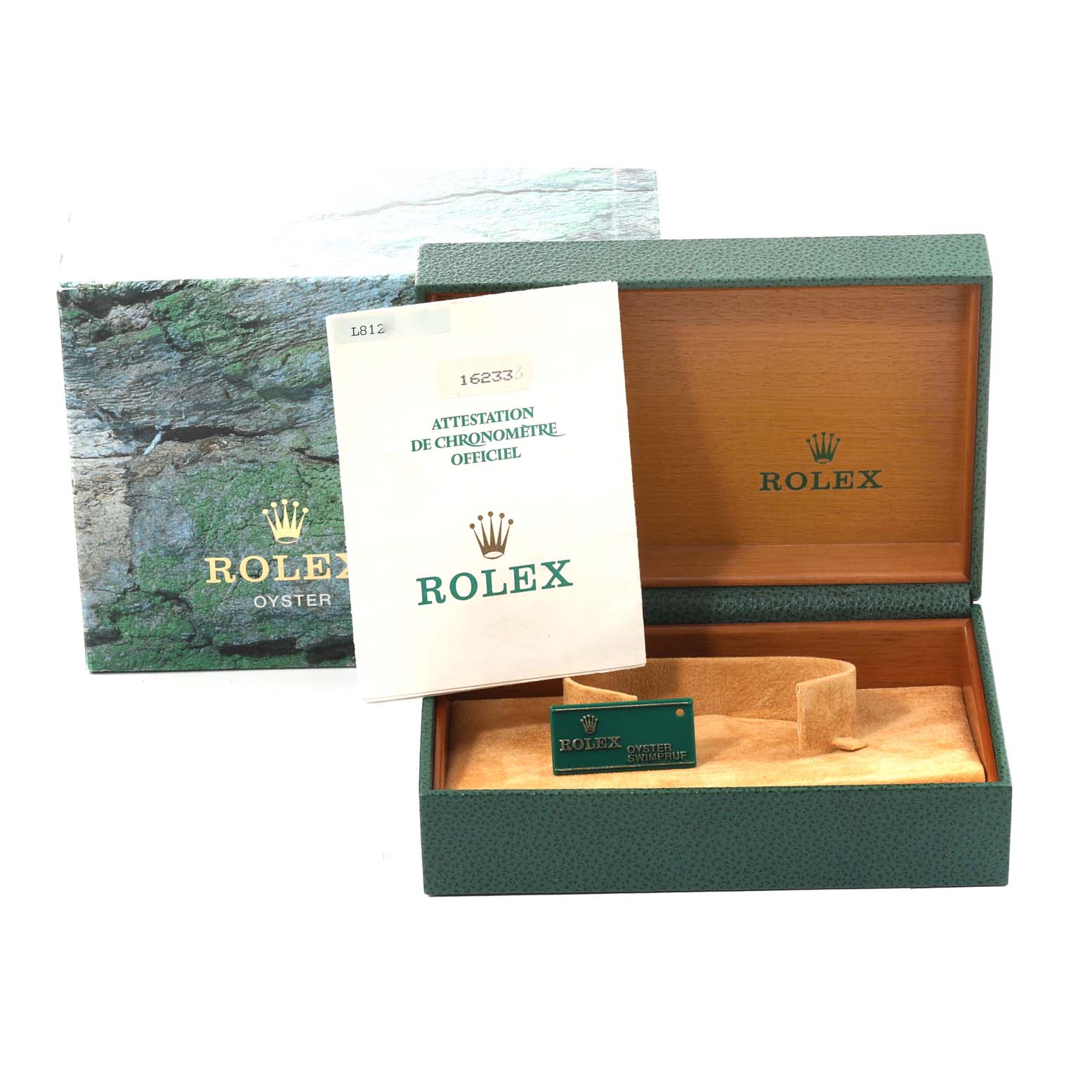 The image shows a Rolex Datejust 16233 Men's Steel and Gold (two tone) Champagne Dial 16233 Men's Steel and Gold (two tone) Champagne Dial watch box, an instruction manual, and an attached green tag, viewed from above.