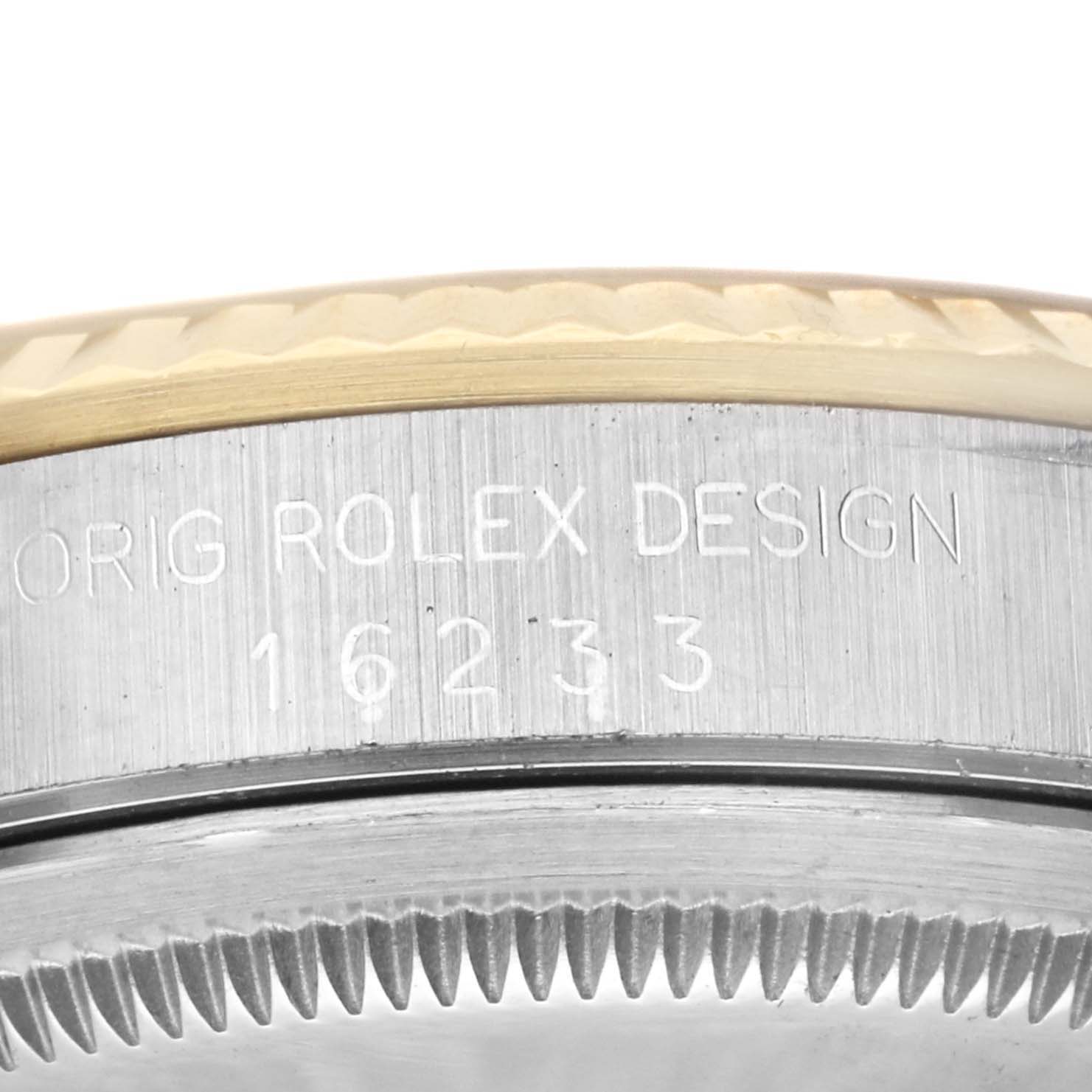 This image shows a close-up of the side of the Rolex Datejust 16233 Men's Steel and Gold (two tone) Champagne Dial 16233 Men's Steel and Gold (two tone) Champagne Dial model, including the bezel and engraving with the model number 16233.