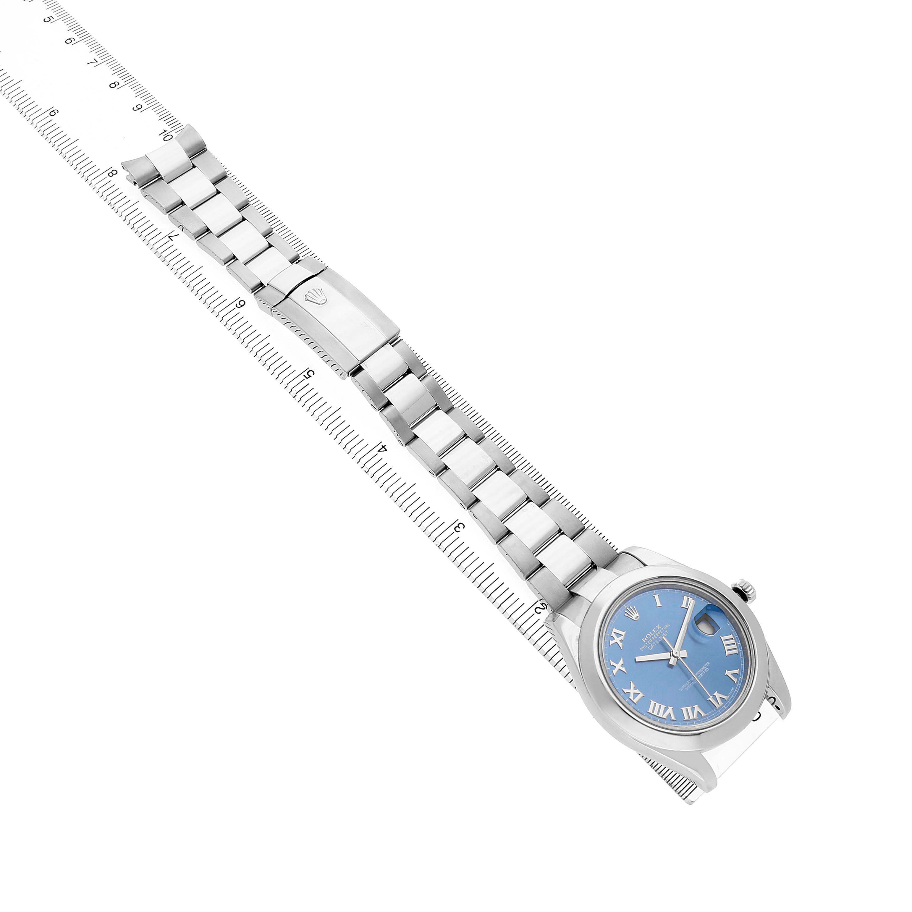 The Rolex Datejust 41 116300 Men's Stainless Steel Blue Dial is shown from a top-down angle, highlighting the blue dial and metal bracelet with a ruler for scale.