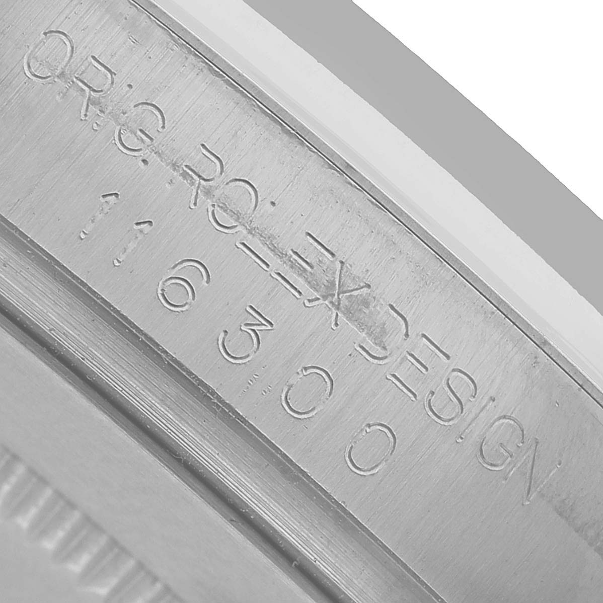 The image shows a close-up of the engraved inner bezel of a Rolex Datejust 41 116300 Men's Stainless Steel Blue Dial watch, highlighting the model and design numbers.