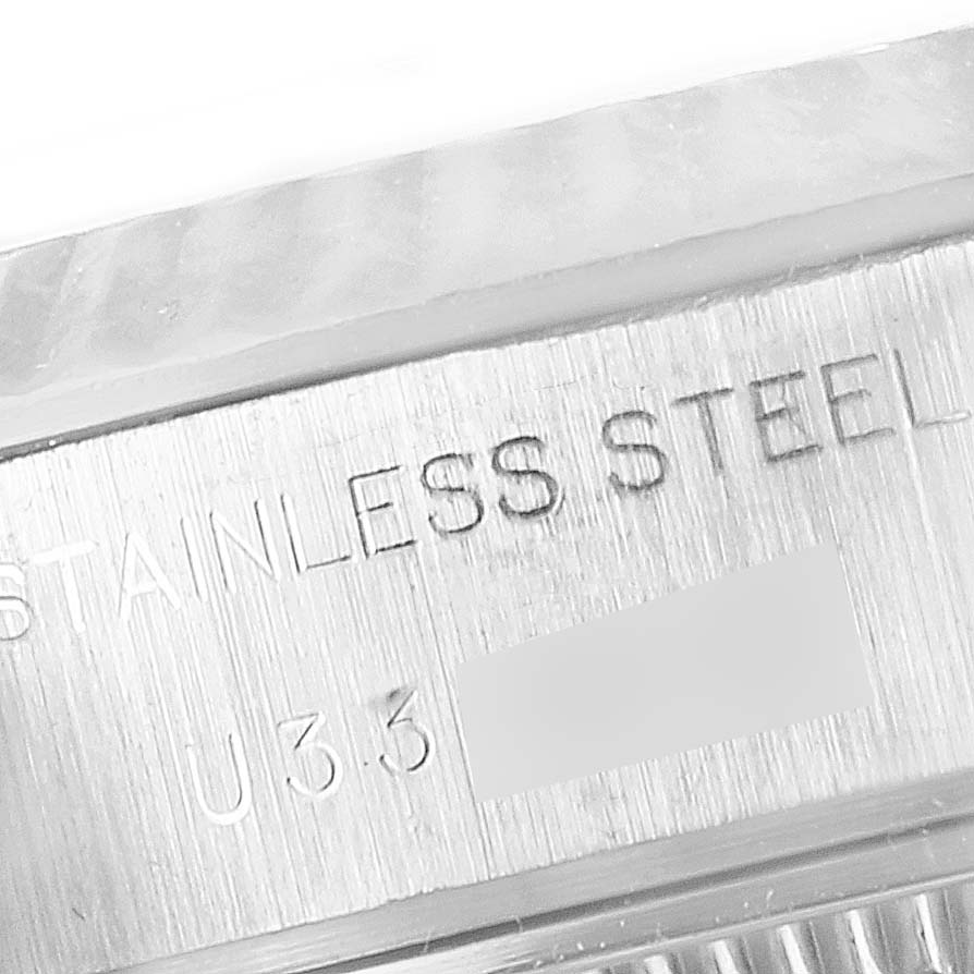 The image shows the engraved "STAINLESS STEEL" marking on the case side of a Rolex Datejust 69174 Women
s Stainless Steel Blue Dial 69174 Women
s Stainless Steel Blue Dial watch.