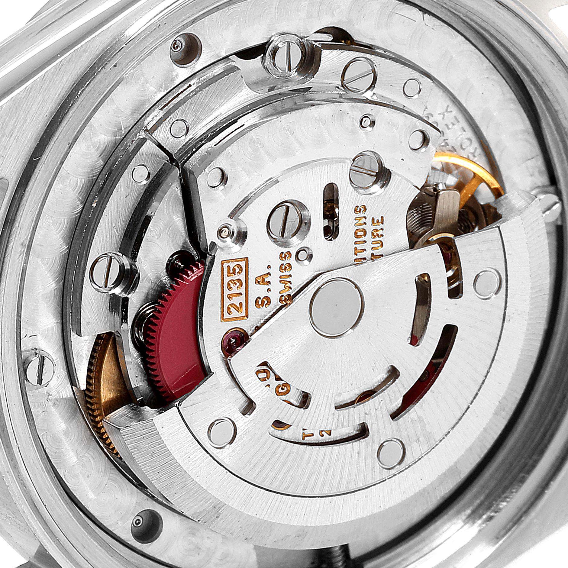 The image shows a close-up of the internal mechanics of a Rolex Mid-Size 68274 Women
s Stainless Steel White Dial 68274 Women
s Stainless Steel White Dial model watch, focusing on the movement.