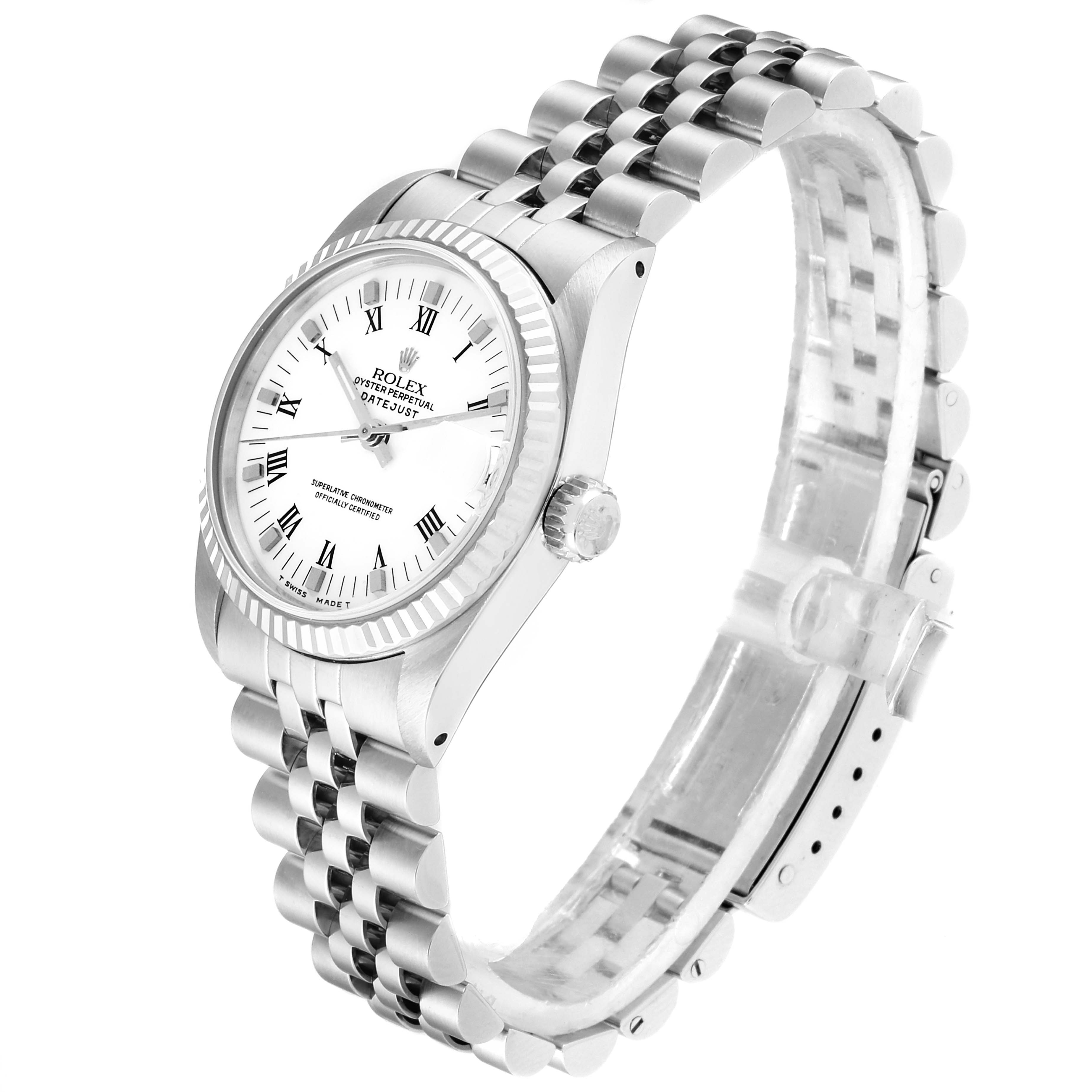 The image shows a side-angle view of a Rolex Mid-Size 68274 Women
s Stainless Steel White Dial 68274 Women
s Stainless Steel White Dial watch, displaying the face, bezel, crown, and part of the bracelet.