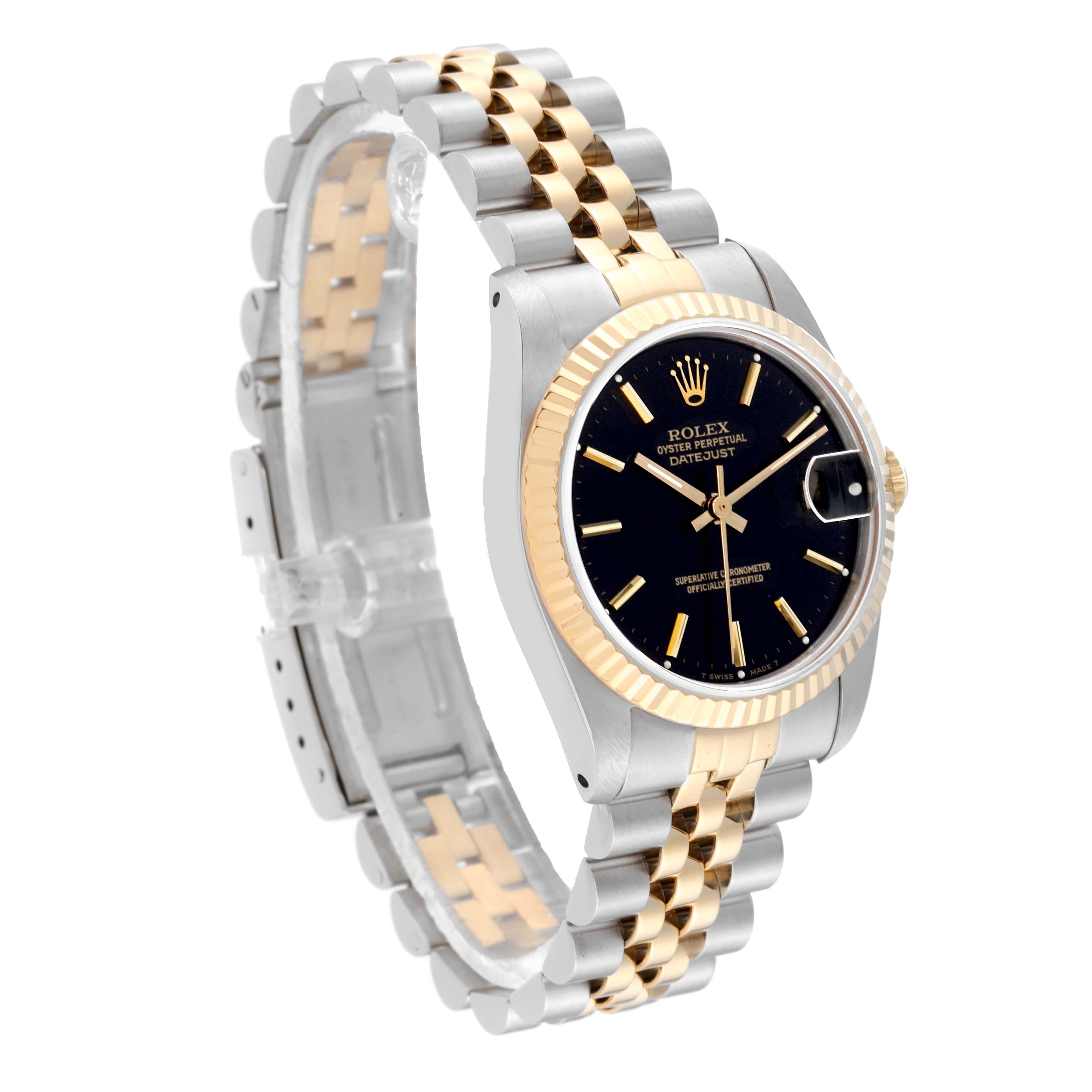 The image shows a Rolex Mid-Size 68273 Women's Steel and Gold (two tone) Black Dial 68273 Women's Steel and Gold (two tone) Black Dial Datejust watch at an angled view, highlighting its two-tone bracelet and black dial.