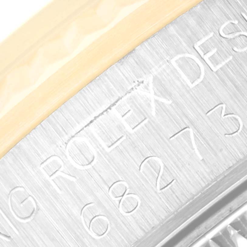 This close-up of a Mid-Size Rolex watch shows part of the engraved case back.