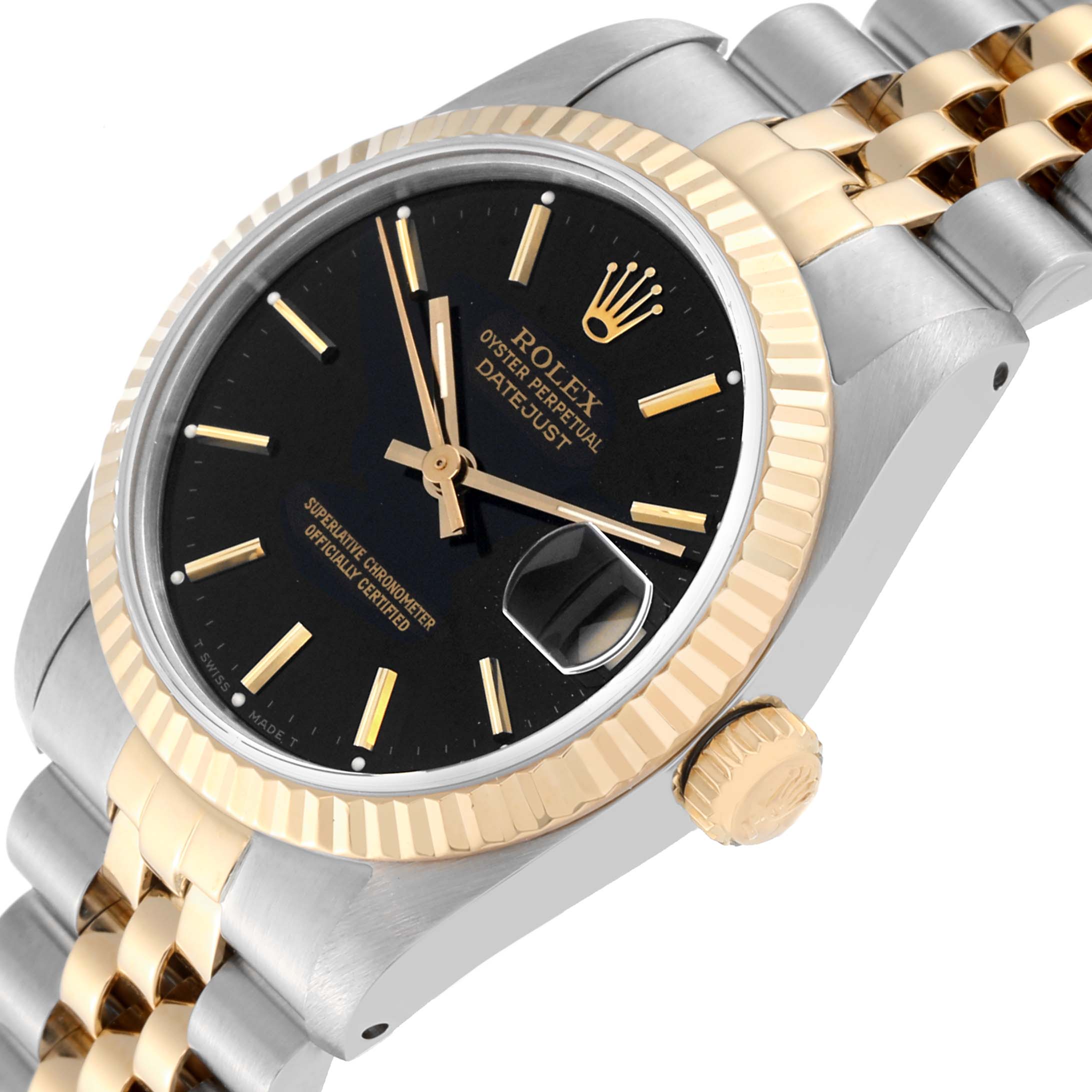 This image shows a close-up view of a Rolex Mid-Size 68273 Women's Steel and Gold (two tone) Black Dial 68273 Women's Steel and Gold (two tone) Black Dial Datejust, featuring the face, bezel, and part of the bracelet.