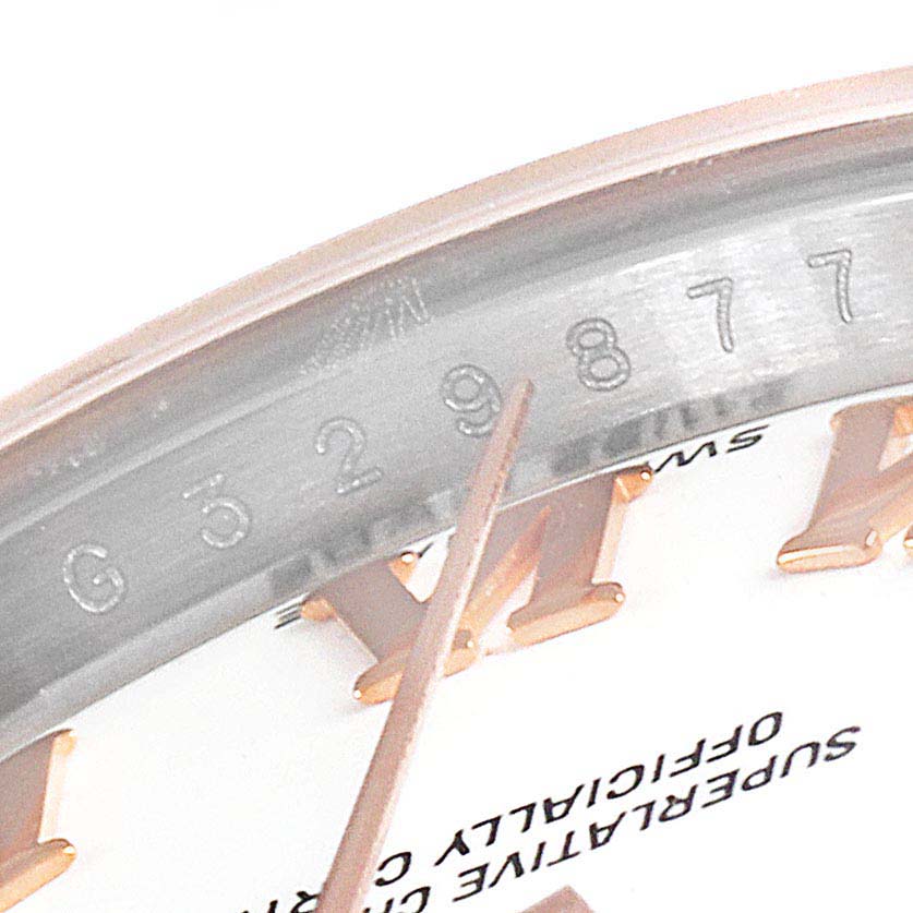 The image shows a close-up of the serial number and part of the dial on a Rolex Datejust 179171 Women
s Steel and Gold (two tone) White Dial 179171 Women
s Steel and Gold (two tone) White Dial watch.