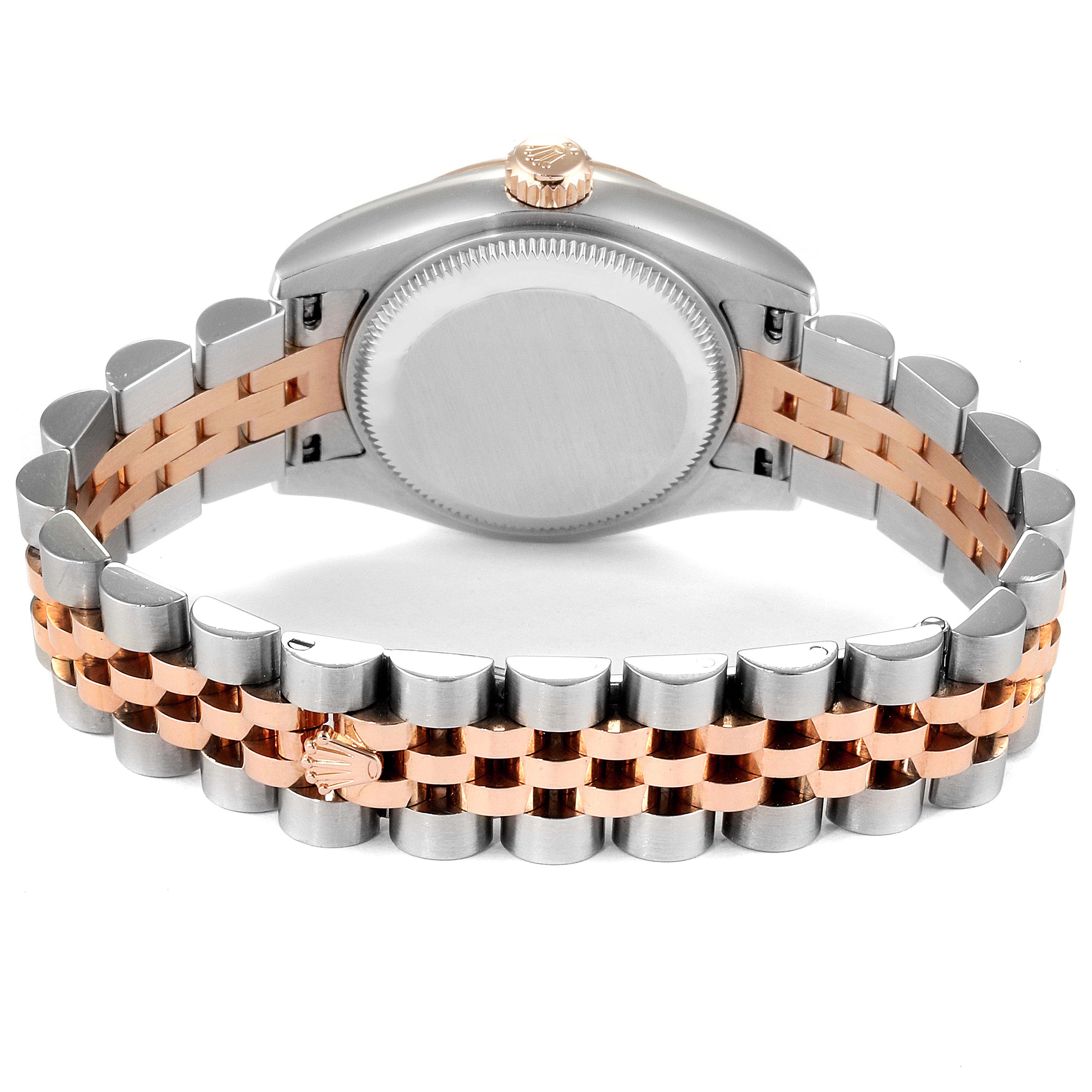 The image shows the back of a Rolex Datejust 179171 Women
s Steel and Gold (two tone) White Dial 179171 Women
s Steel and Gold (two tone) White Dial watch, highlighting the case back and two-tone bracelet with the Rolex logo on the clasp.