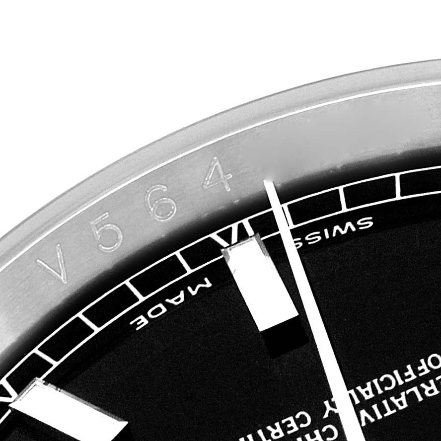 This image shows a close-up of the dial and engraved bezel of a Rolex Datejust 116234 Men's Stainless Steel Black Dial 116234 Men's Stainless Steel Black Dial watch.
