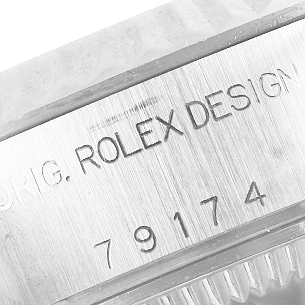 This image shows a close-up of the engraving on the side of a Rolex Datejust 79174 Women
s Stainless Steel Mother of Pearl Dial 79174 Women
s Stainless Steel Mother of Pearl Dial watch, specifically focusing on the model number.