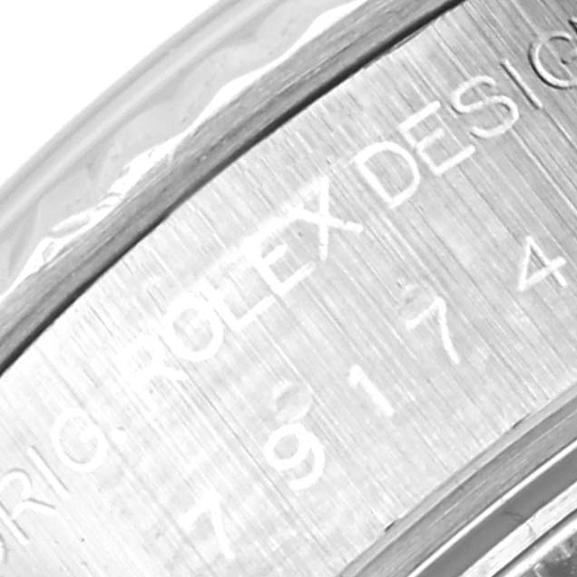 This image shows a close-up of the engraved inner bezel of a Rolex Datejust 79174 Women
s Stainless Steel Mother of Pearl Dial 79174 Women
s Stainless Steel Mother of Pearl Dial model.