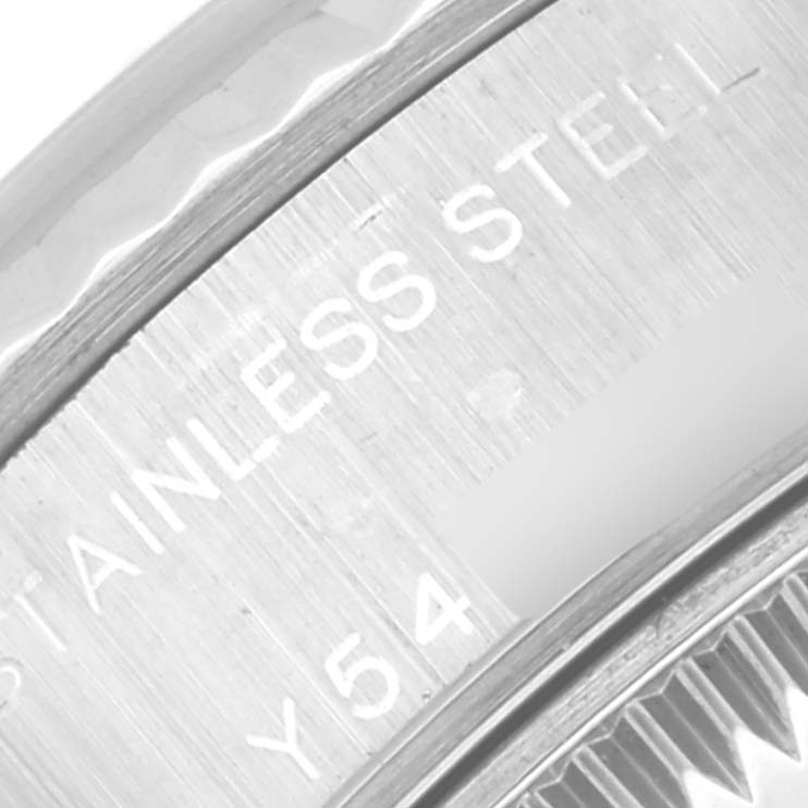 This close-up image shows part of the stainless steel casing and engraved lettering of a Rolex Datejust 79174 Women's Stainless Steel Silver Dial 79174 Women's Stainless Steel Silver Dial watch.